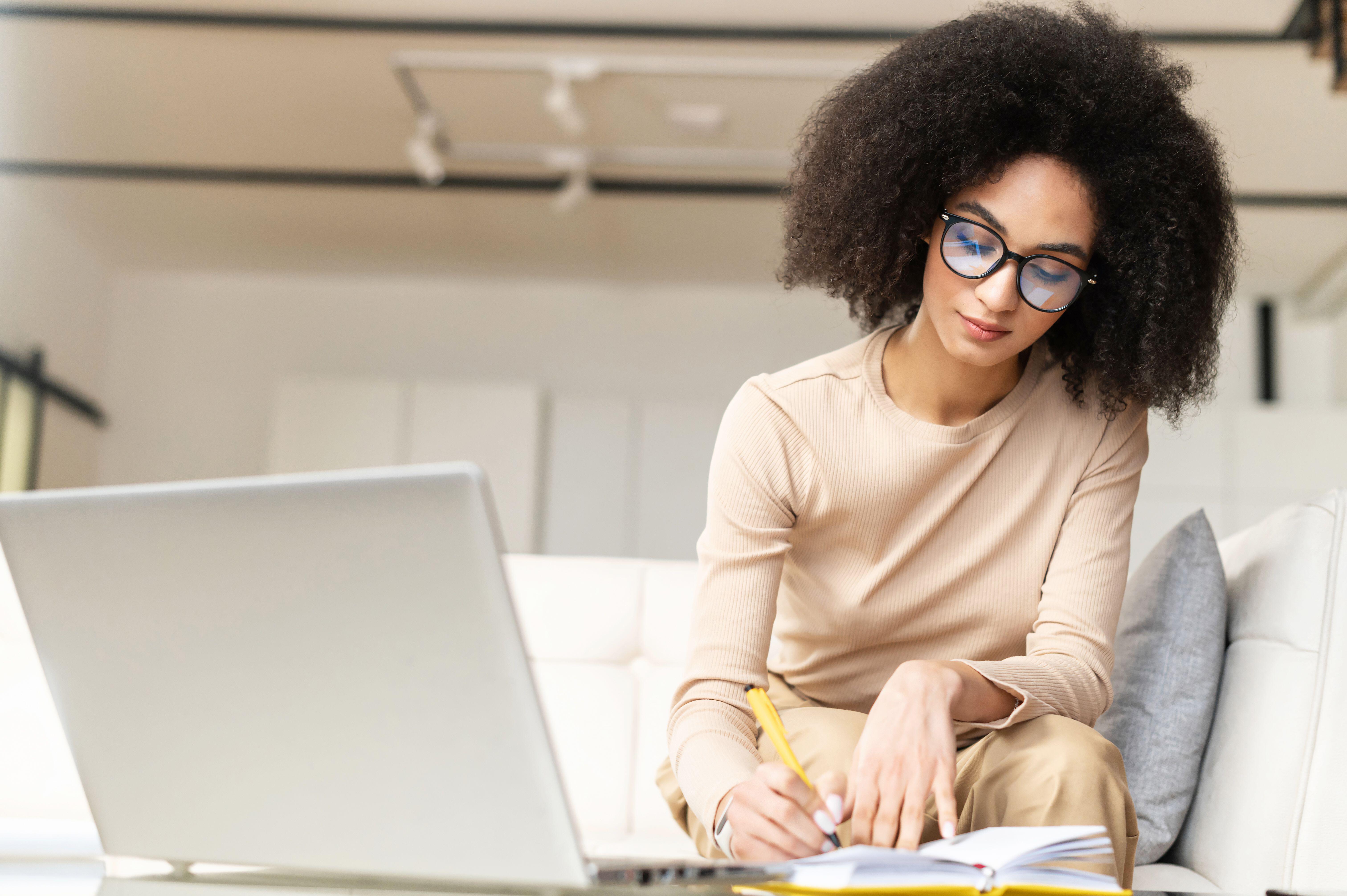 Young woman writing a list