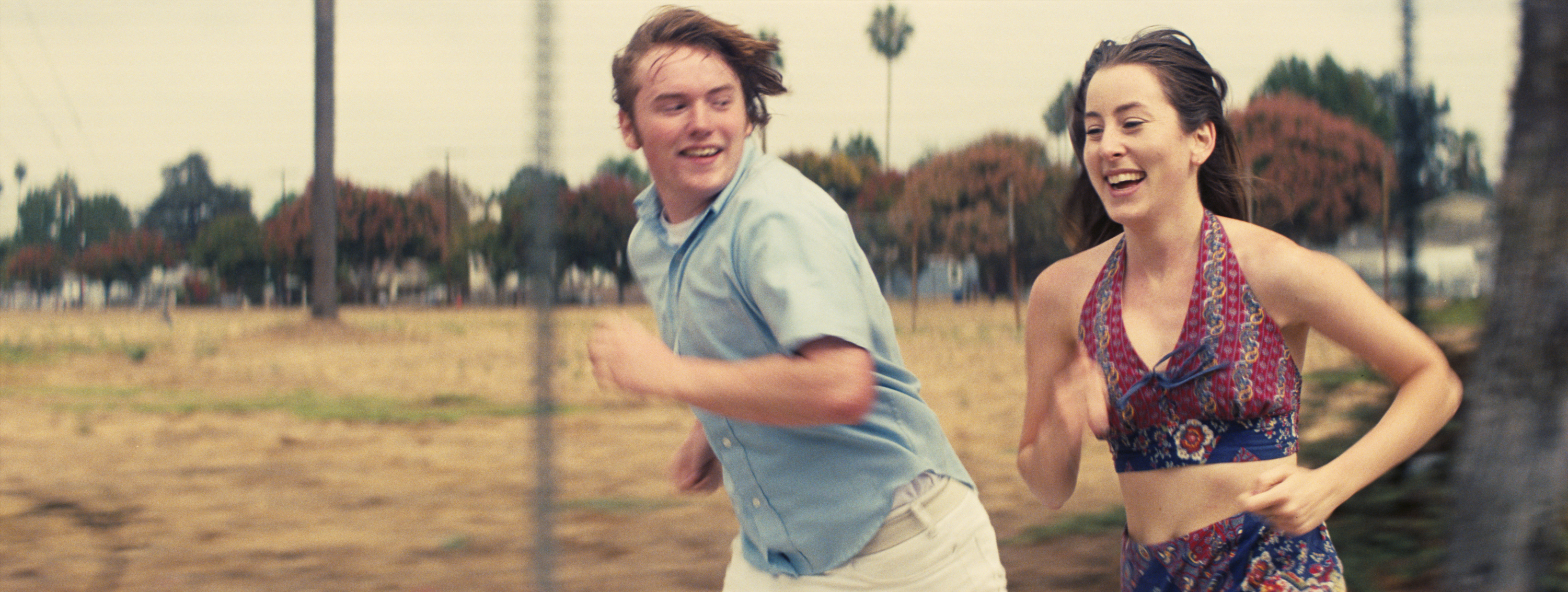 Cooper Hoffman as Gary, Alana Haim as Alana in Licorice Pizza