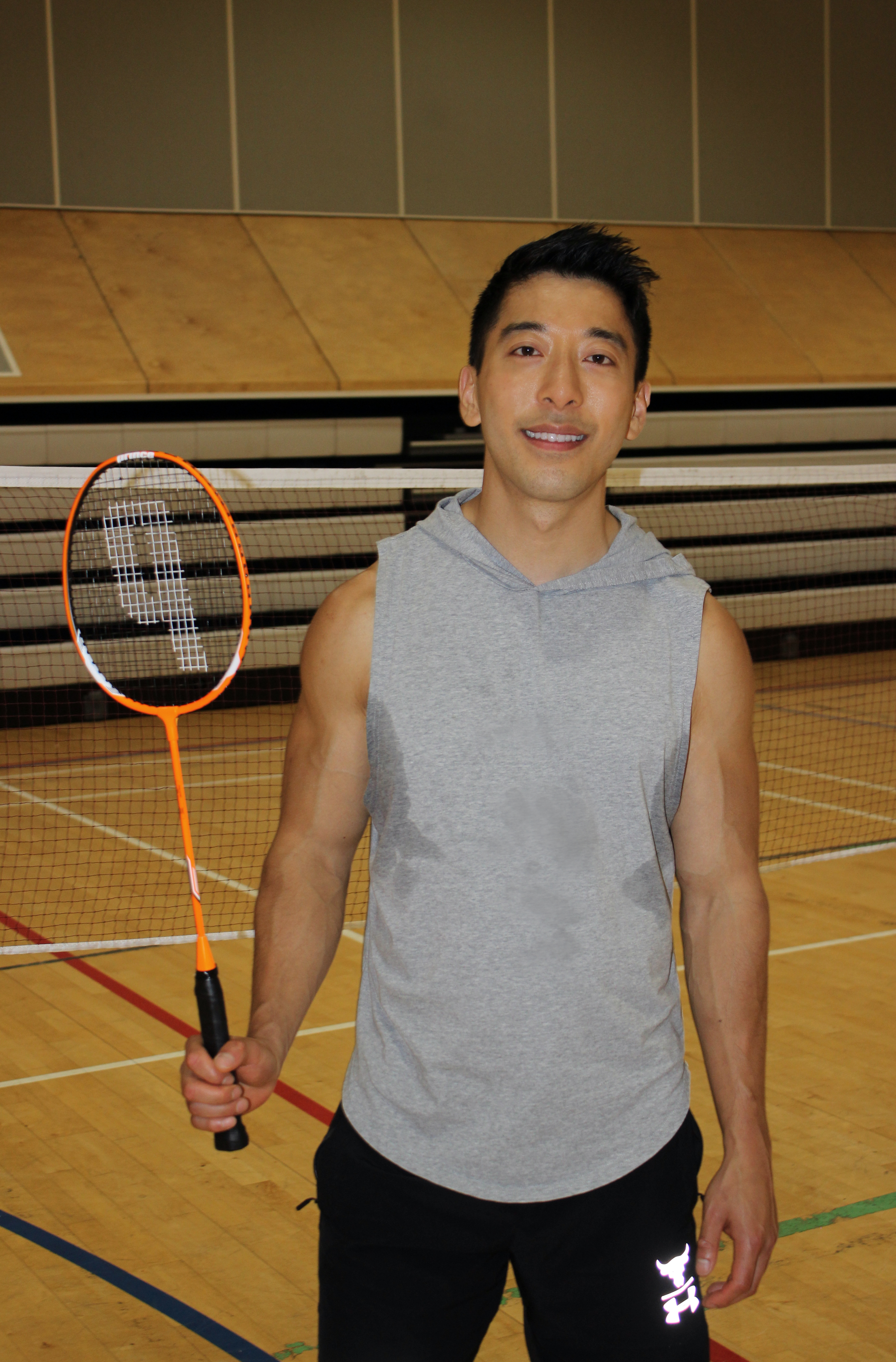 Man posing with racket