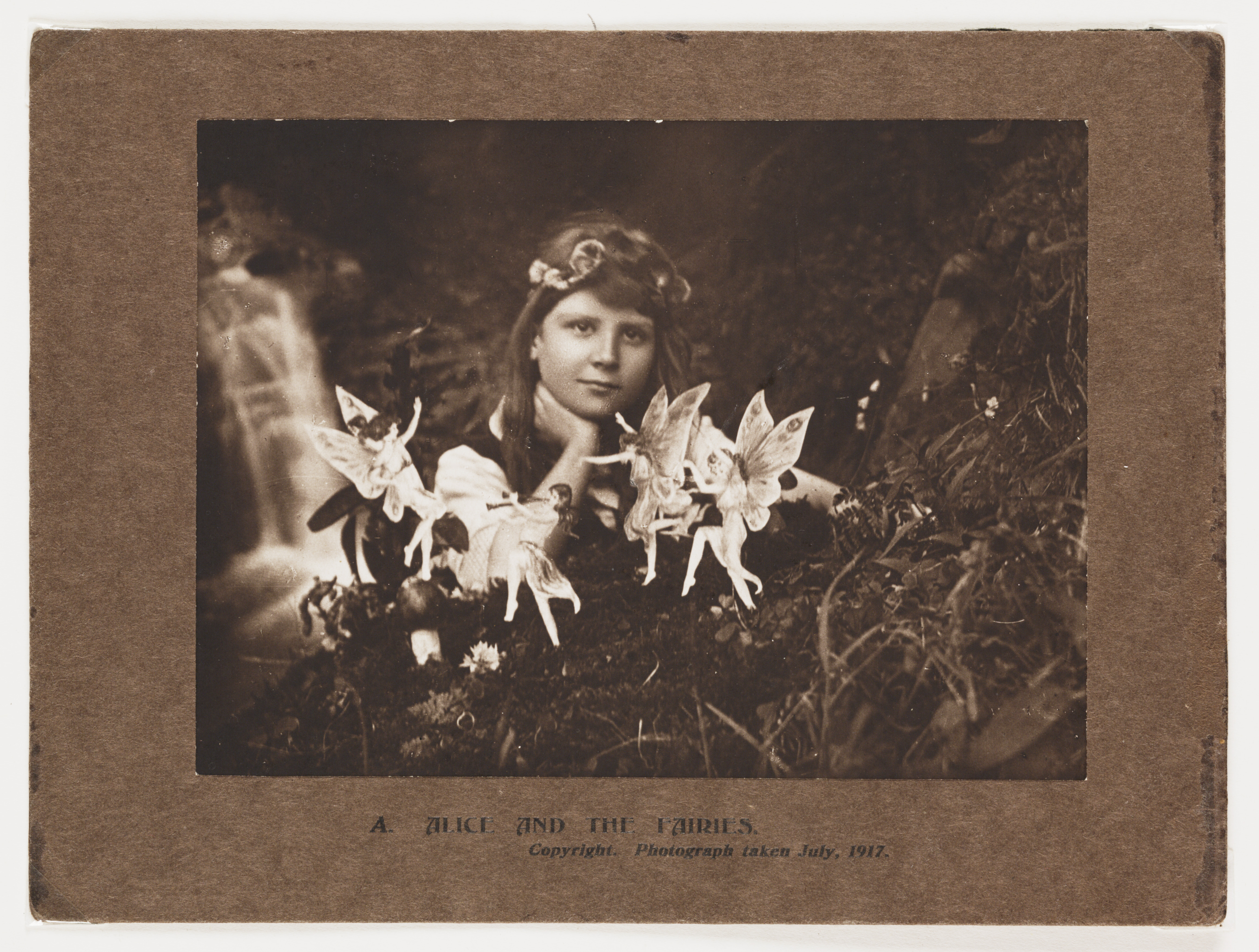 An image showing a girl with fairies  