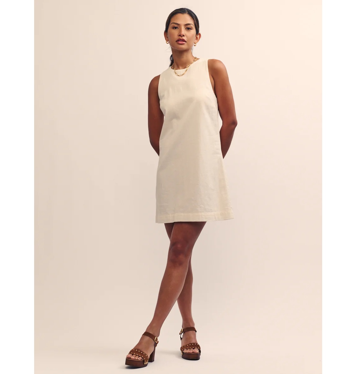 Model wears cream cotton mod shift dress