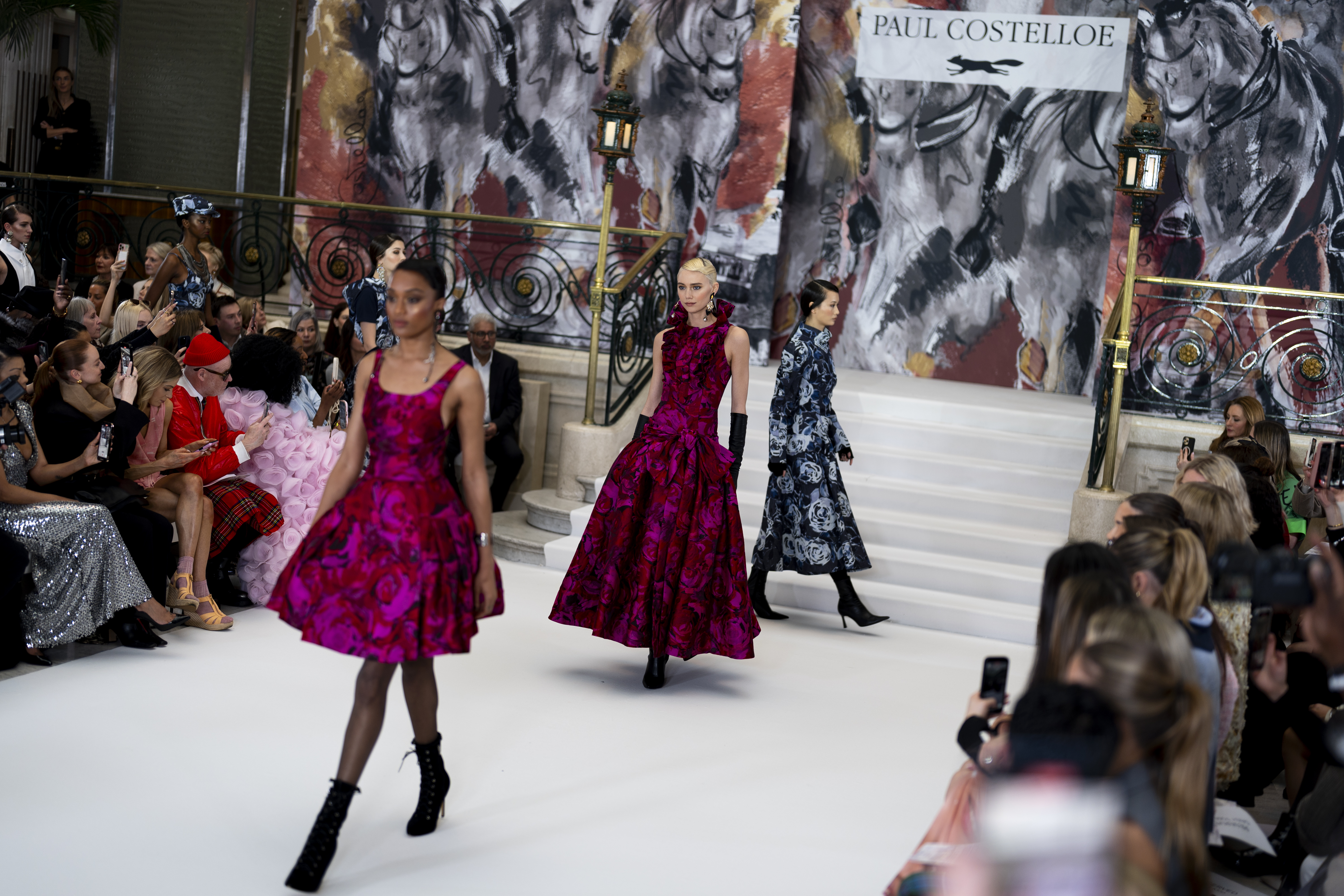 Models wear bold floral prints on runway