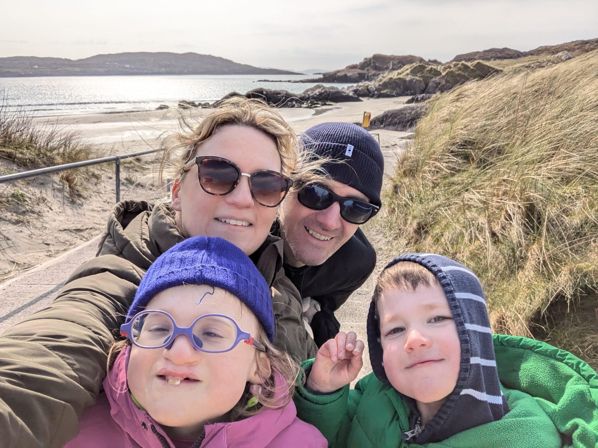 A family of four on a beach
