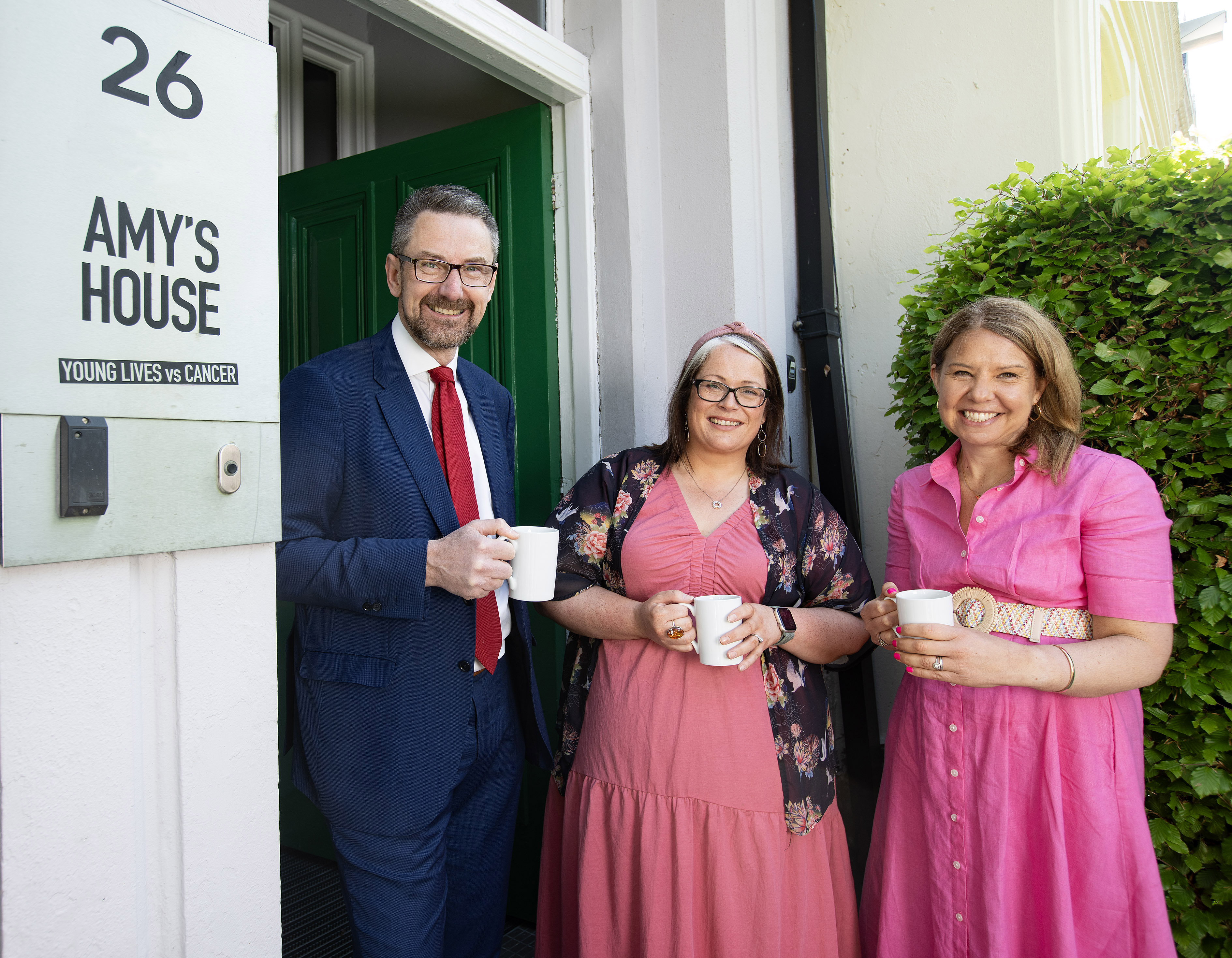 Malcolm Fleming, director of public affairs, People’s Postcode Lottery; Sian Mulholland MLA (centre), and Rachel Kirby-Rider, chief executive at Young Lives vs Cancer, at Amy's House in Belfast