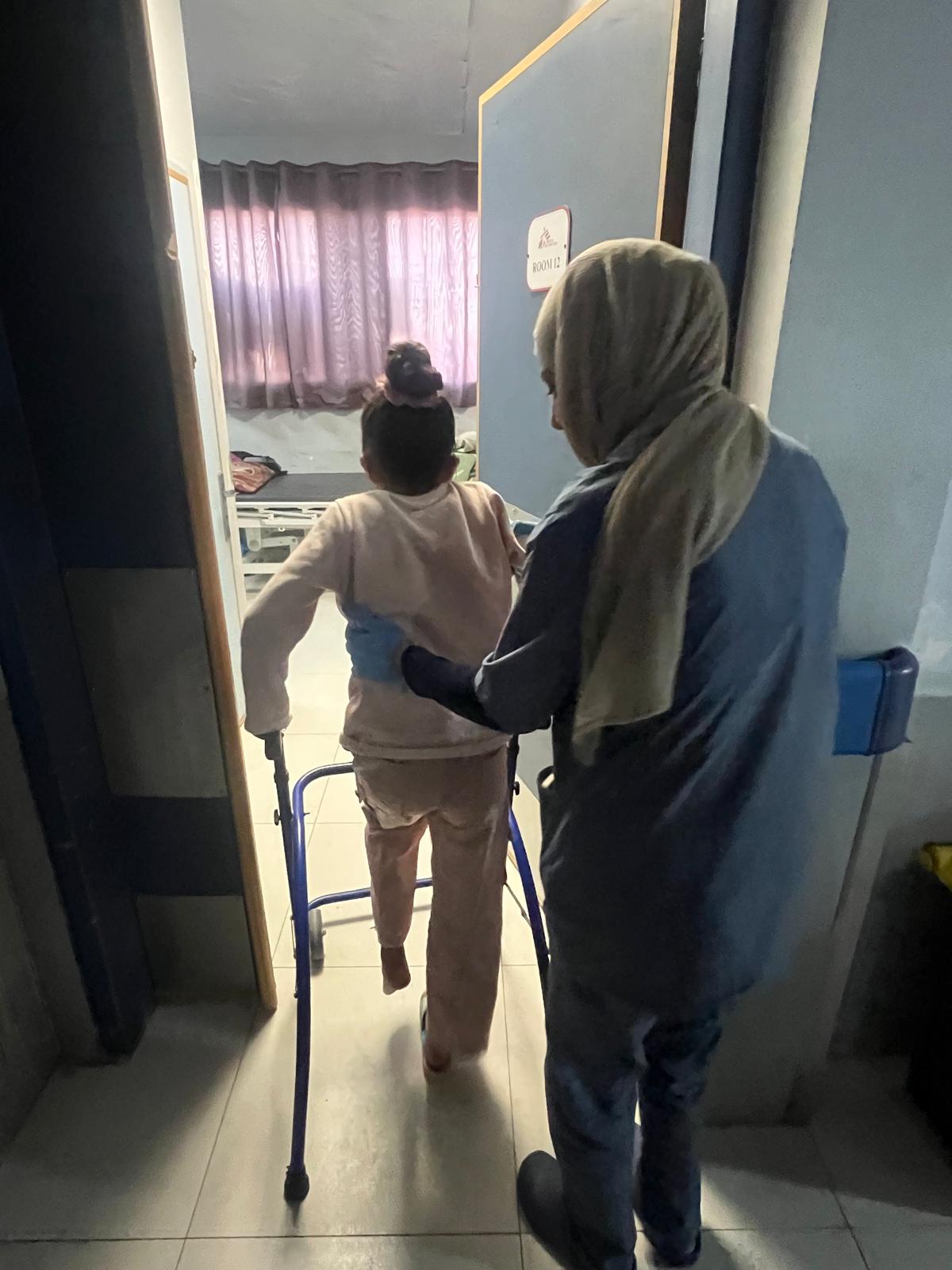 A child using a walking frame