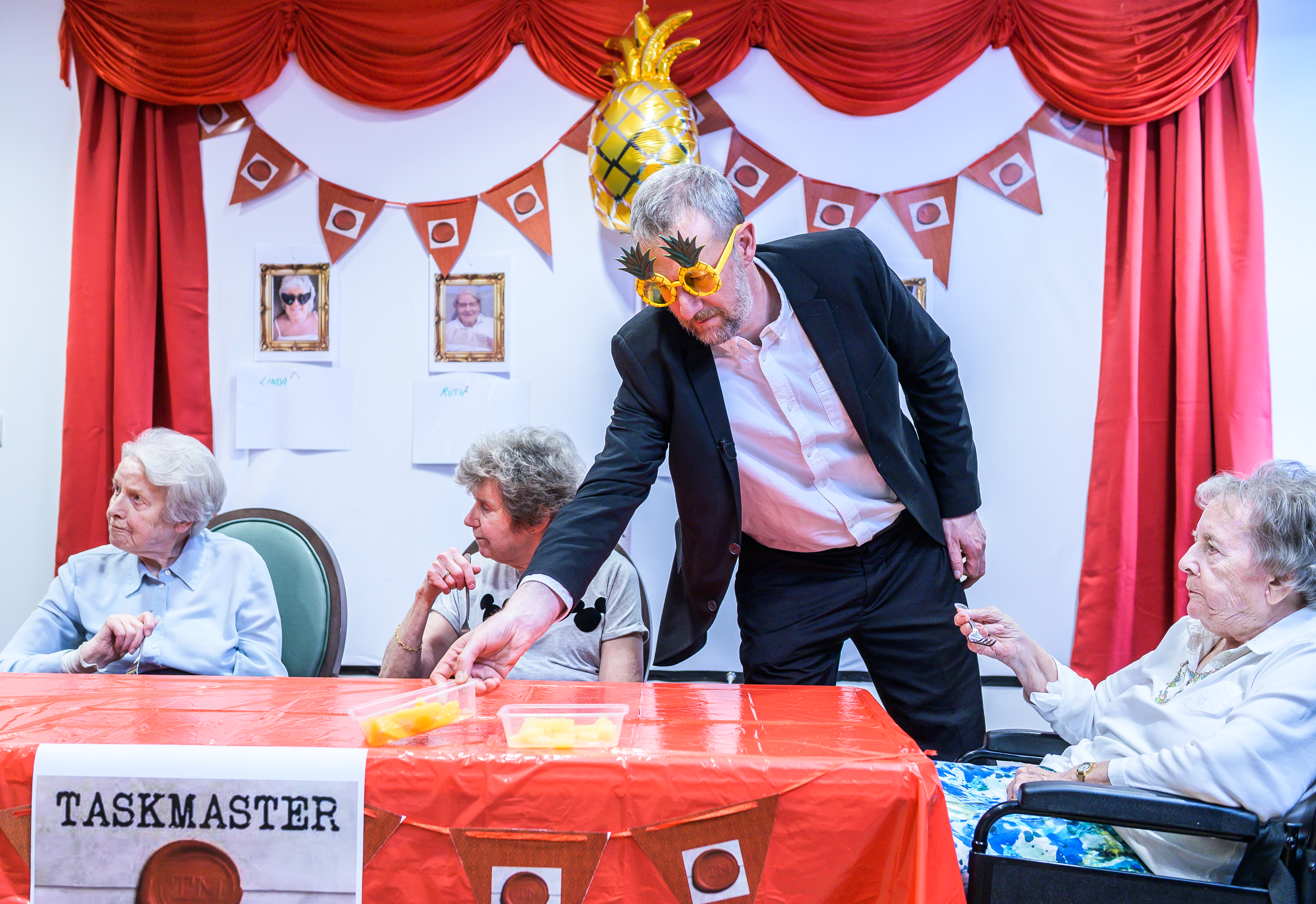 A man in fancy dress at a care home