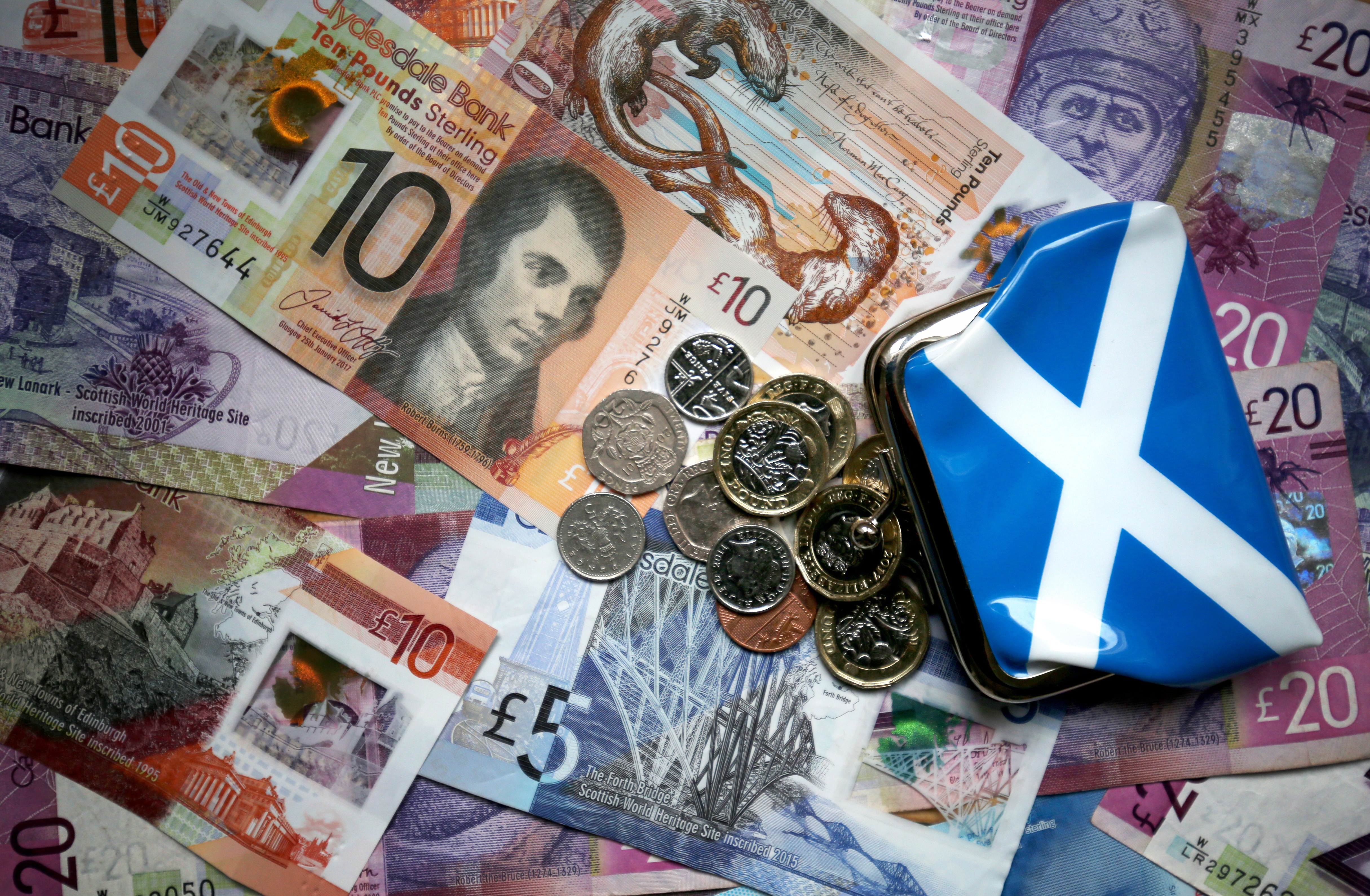 Banknotes and coins with a Scottish saltire purse