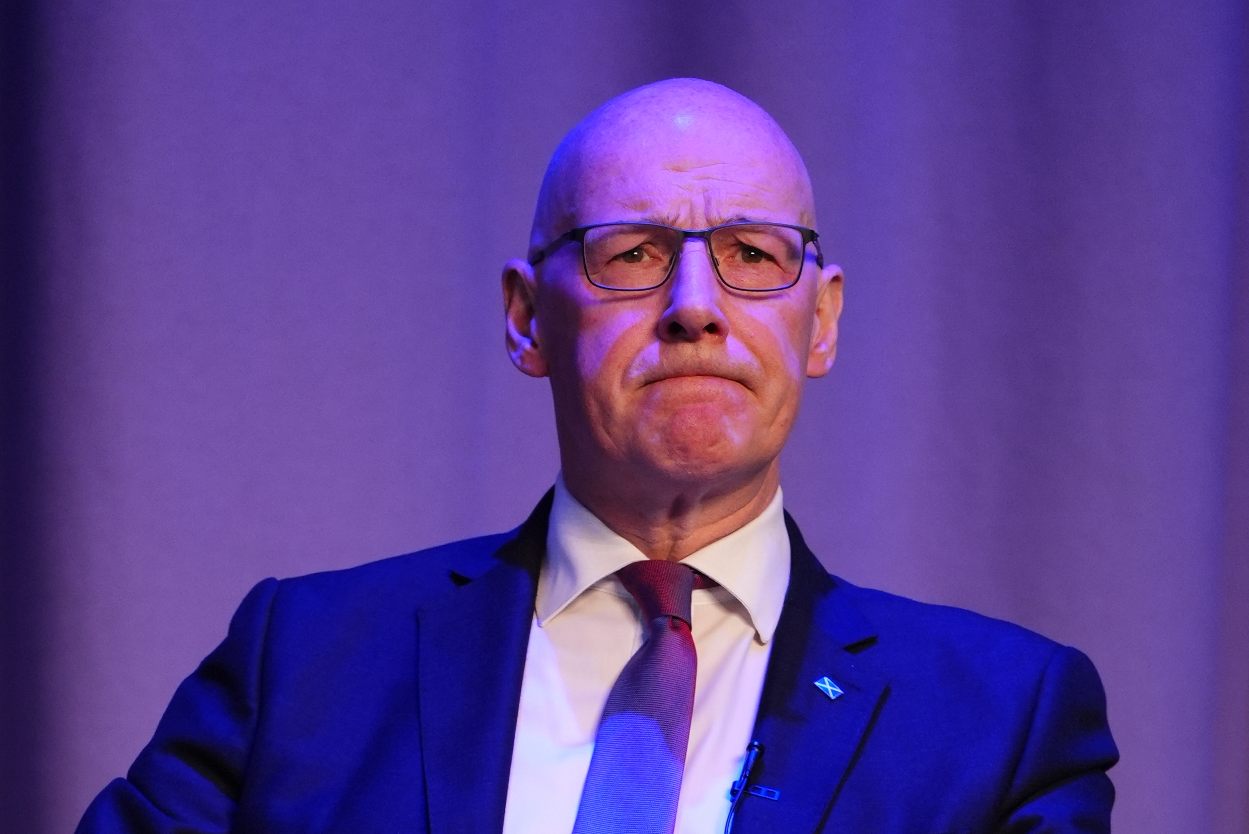 Head and shoulders photo of John Swinney seated