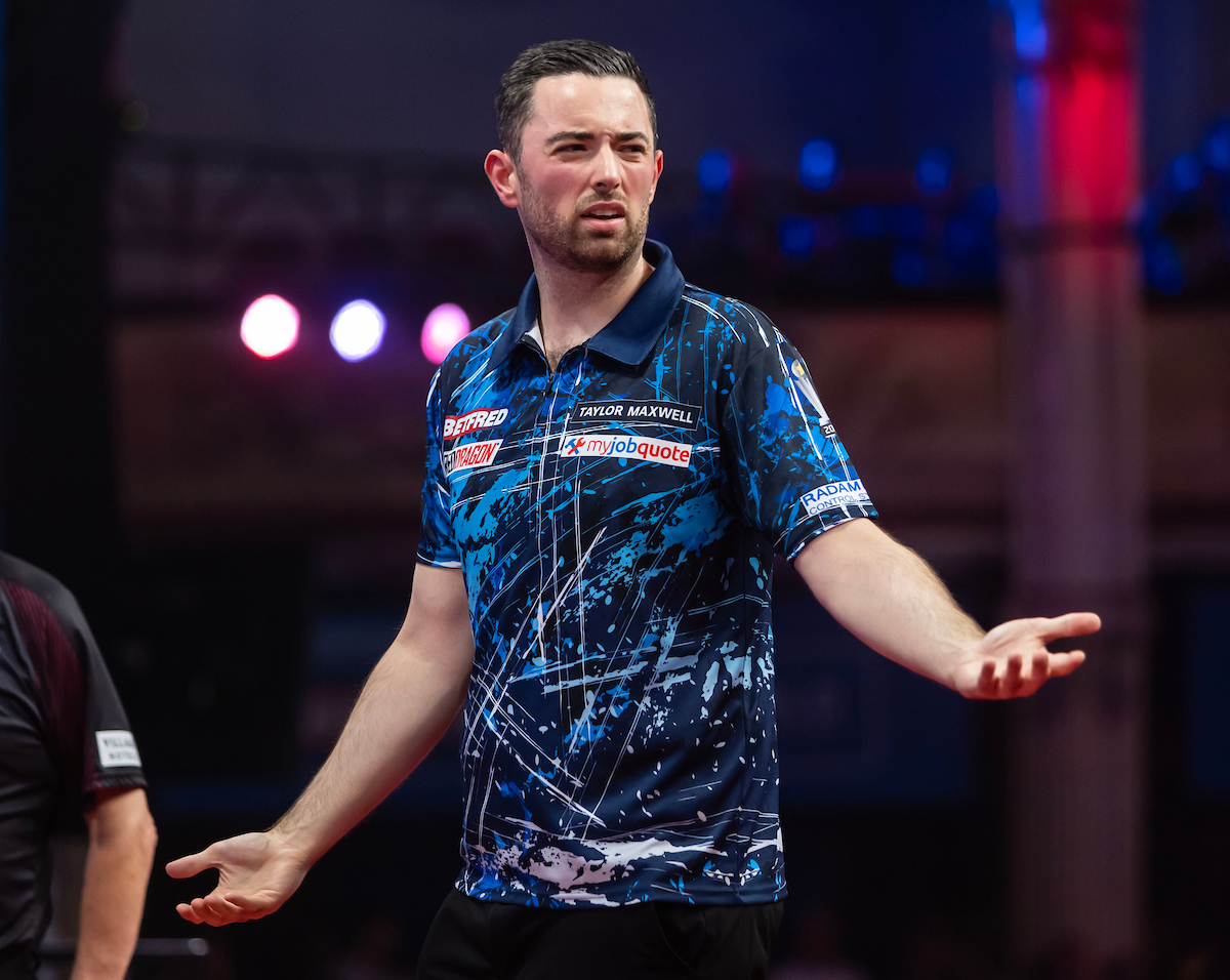 Luke Humphries looks exasperated on stage