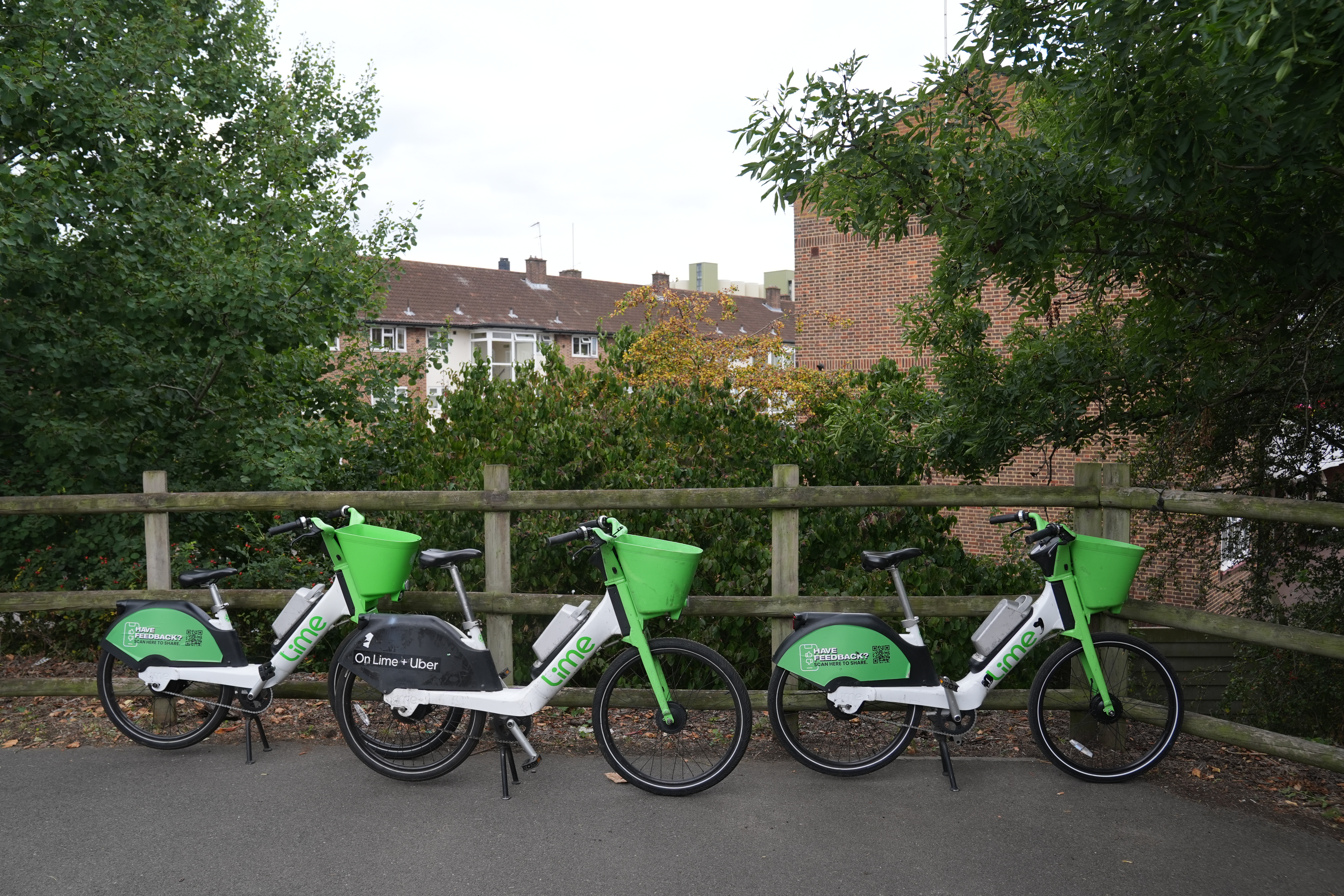 Lime bikes near the south entrance to Chiswick bridge in London