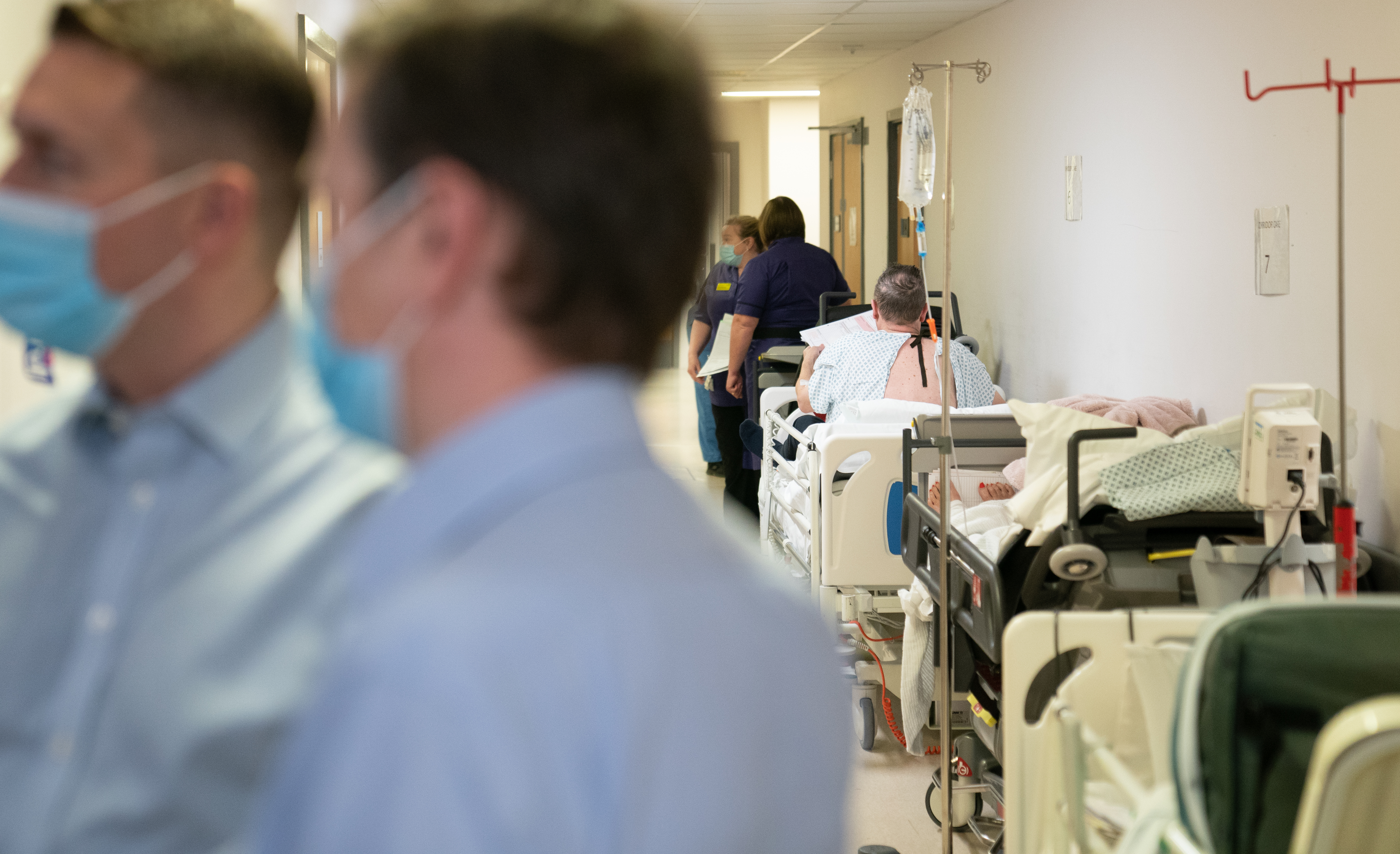 Patients on beds in corridors
