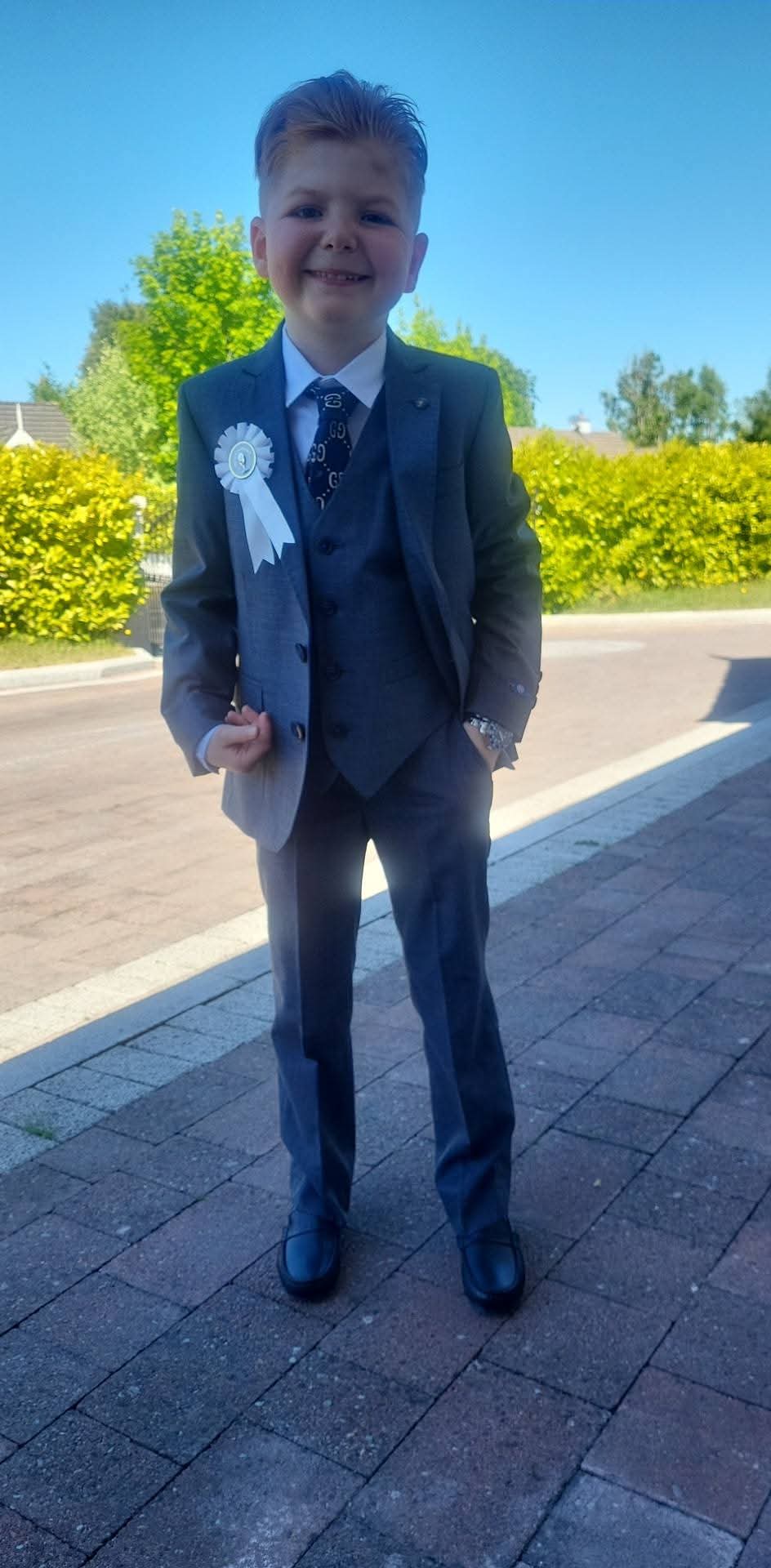 Nine year old Andy wearing a suit