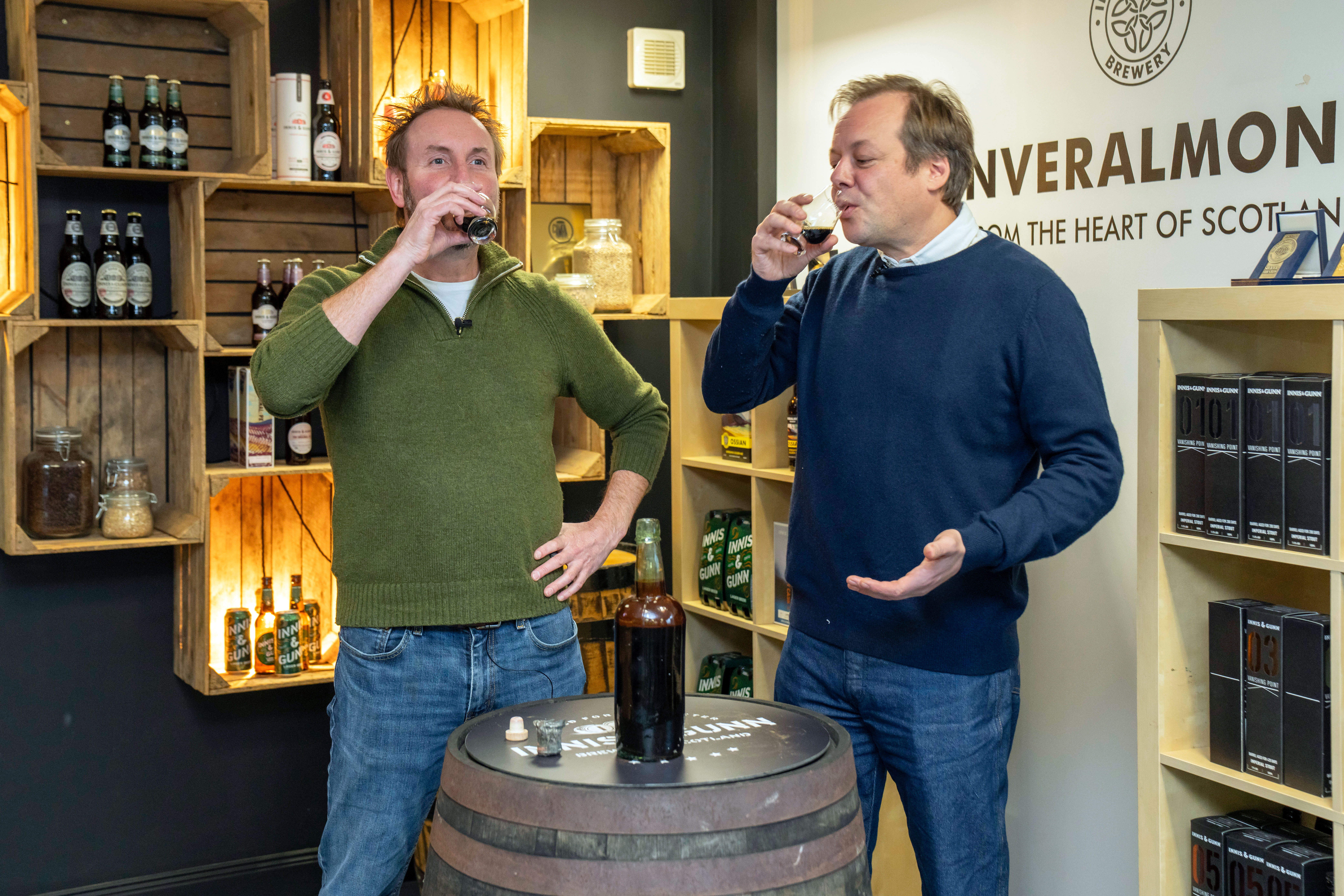 Dougal Gunn Sharp and Jamie Allsopp drinking a small glass of beer