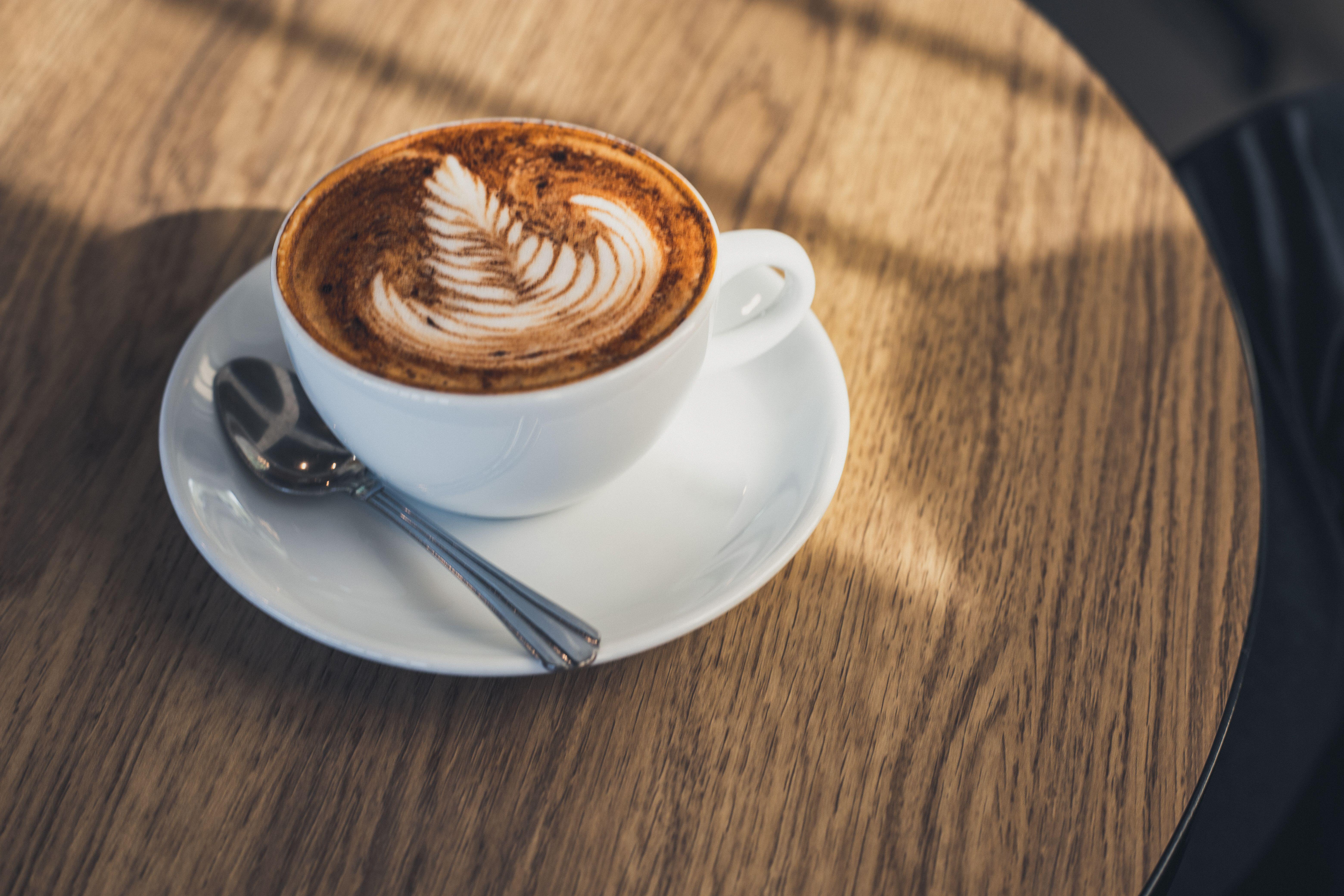 A latte on a wooden table