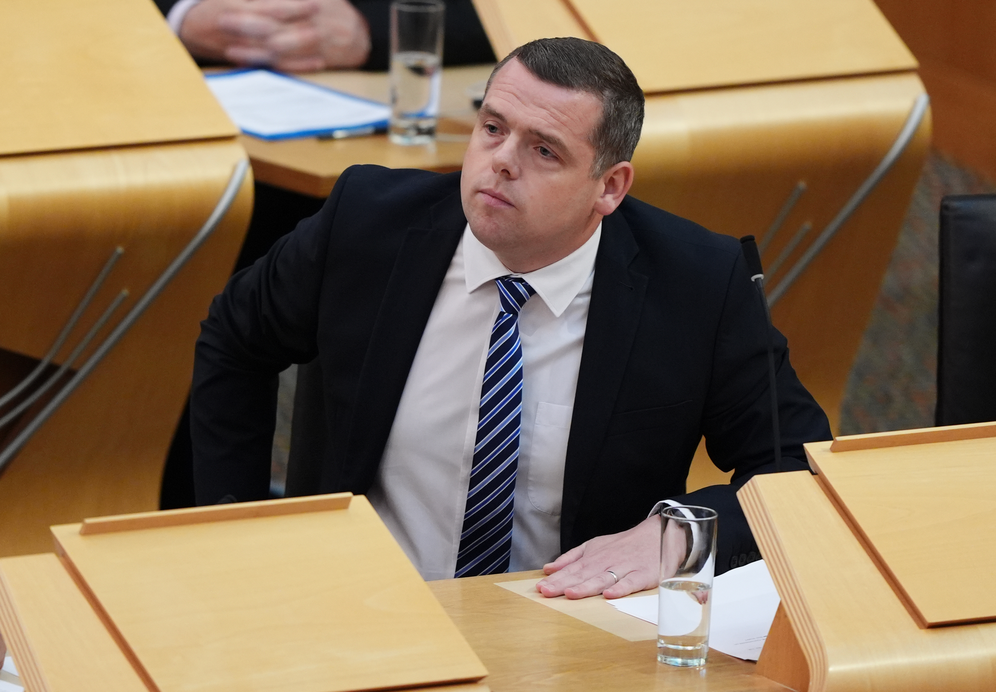Douglas Ross seated in Holyrood