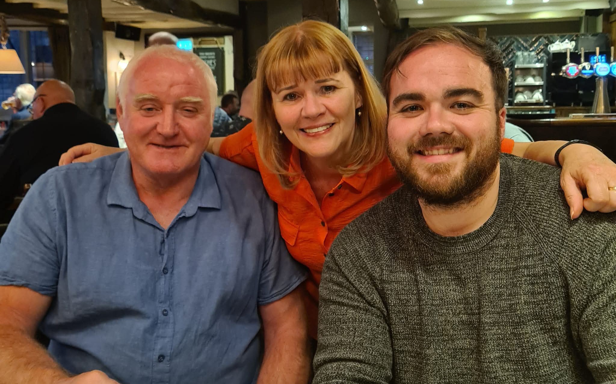 Elena Walsh, centre, with her husband and son