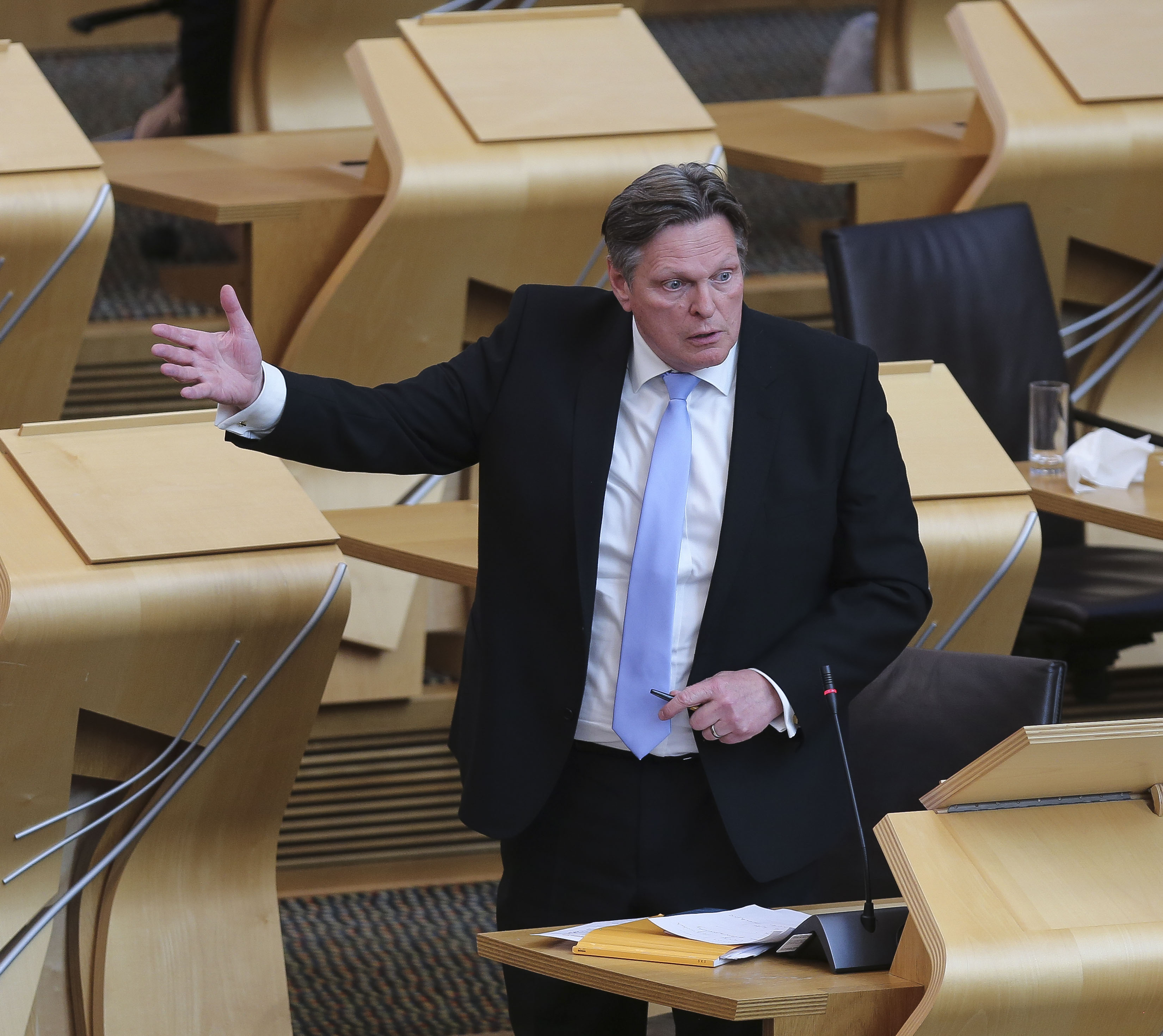 Scottish Conservative MSP Stephen Kerr gestures while speaking