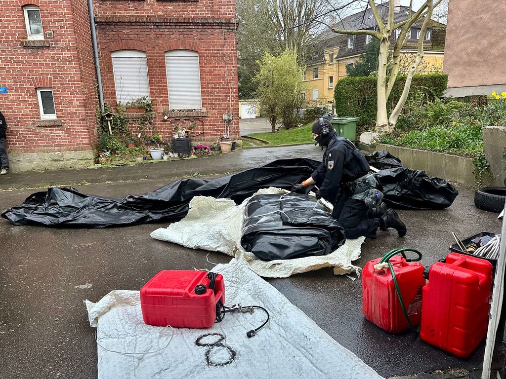 Petrol cans and an inflatable boat