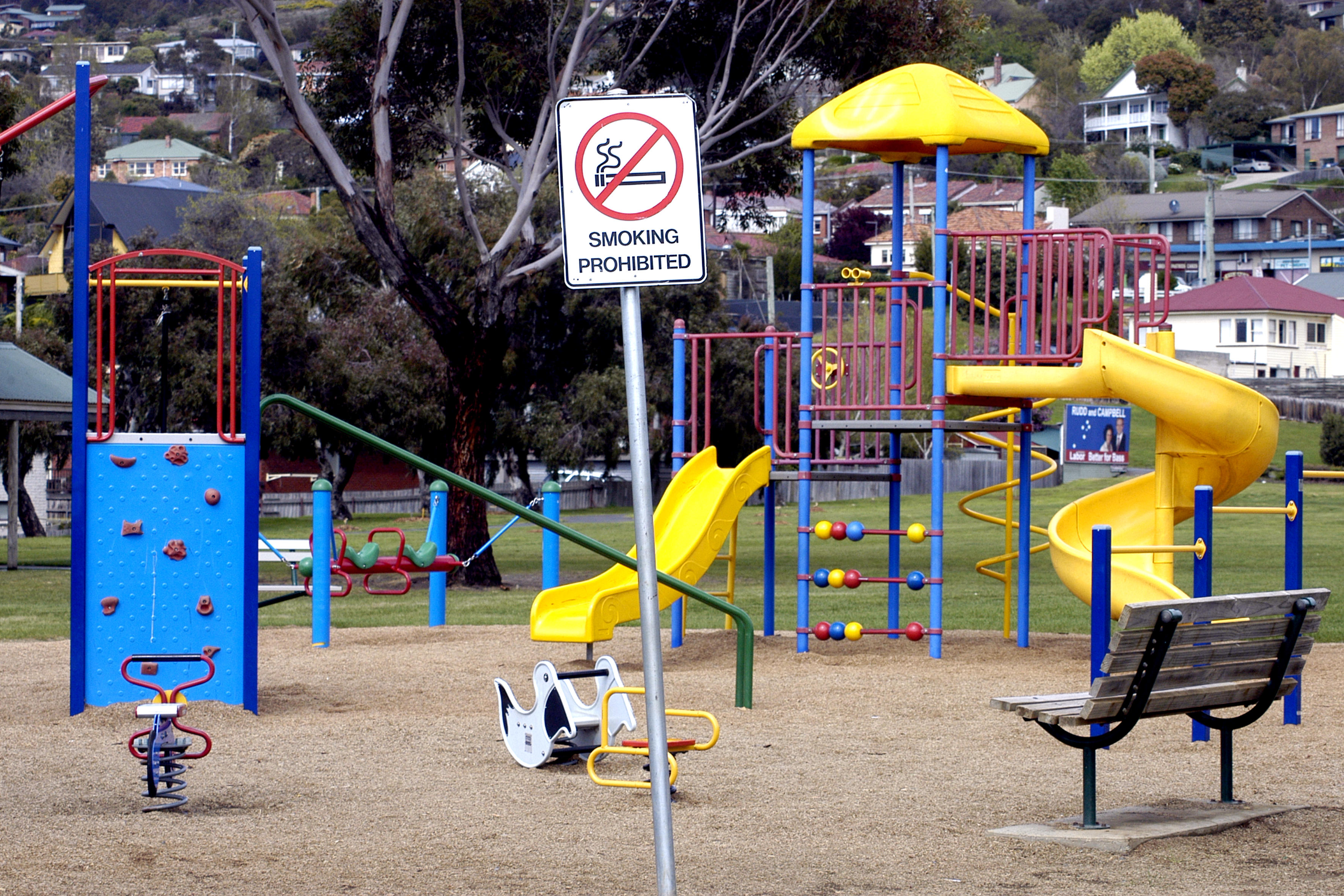 A playground with a smoking prohibited sign