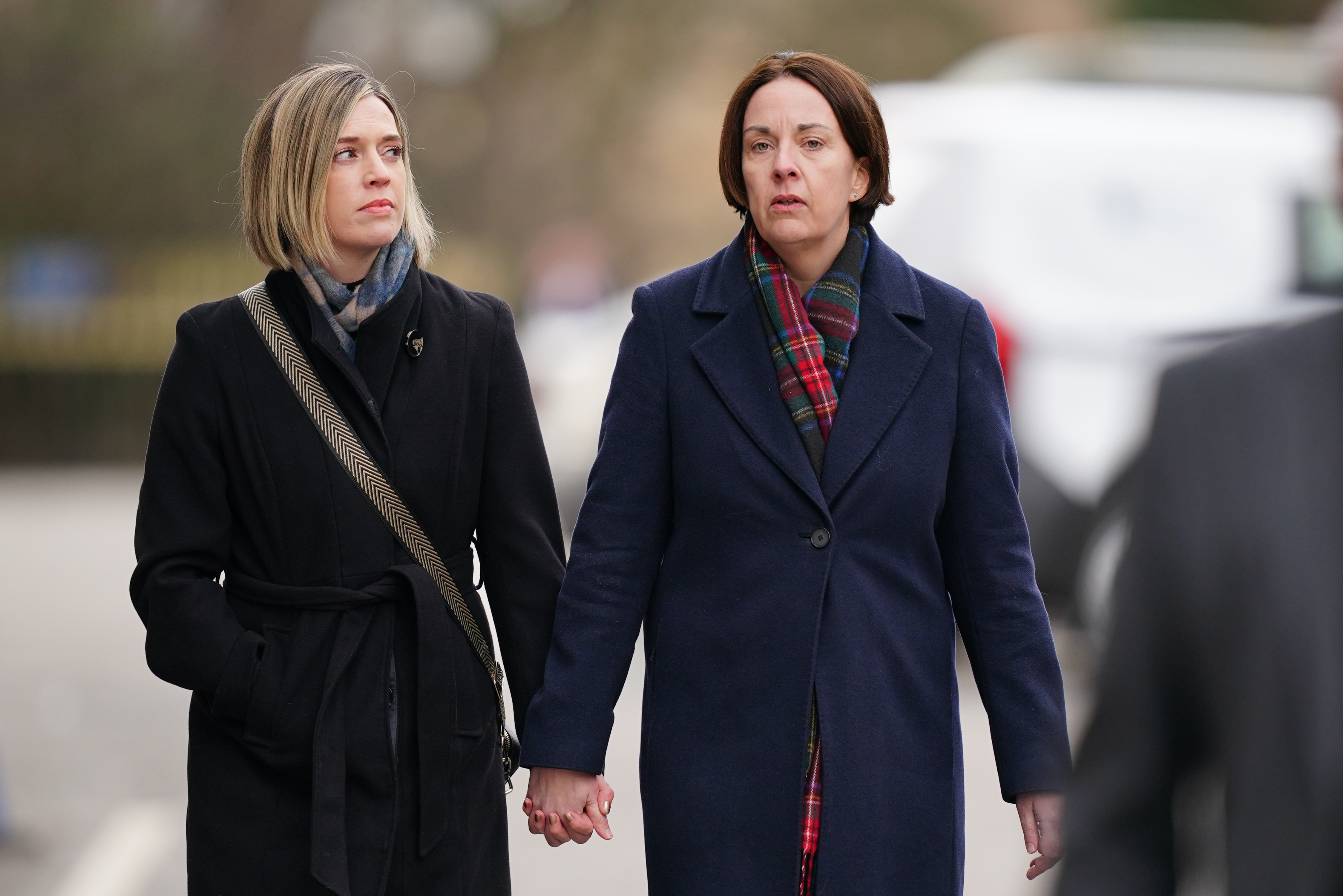 Jenny Gilruth and Kezia Dugdale holding hands while walking outside