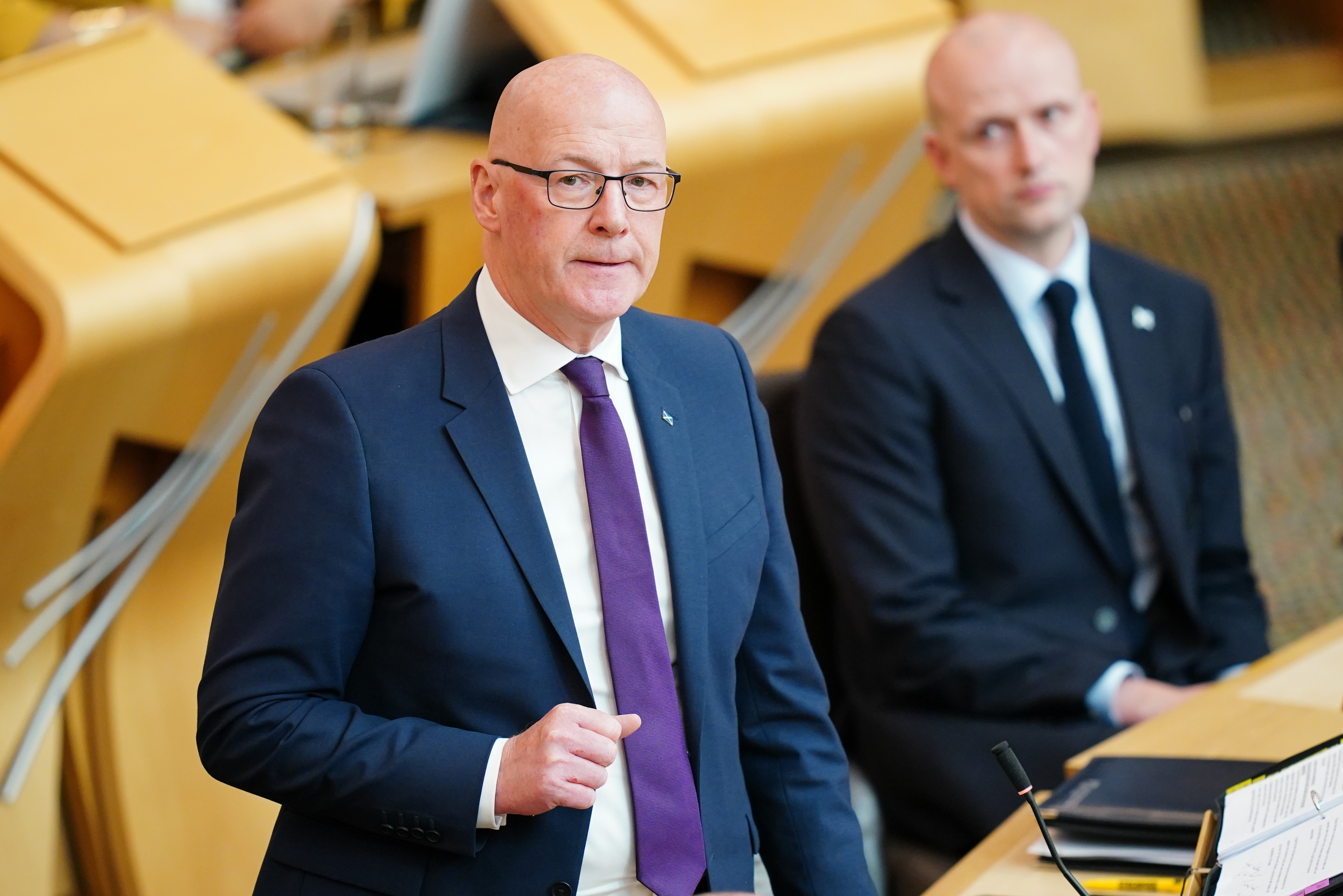 John Swinney standing while speaking in Holyrood