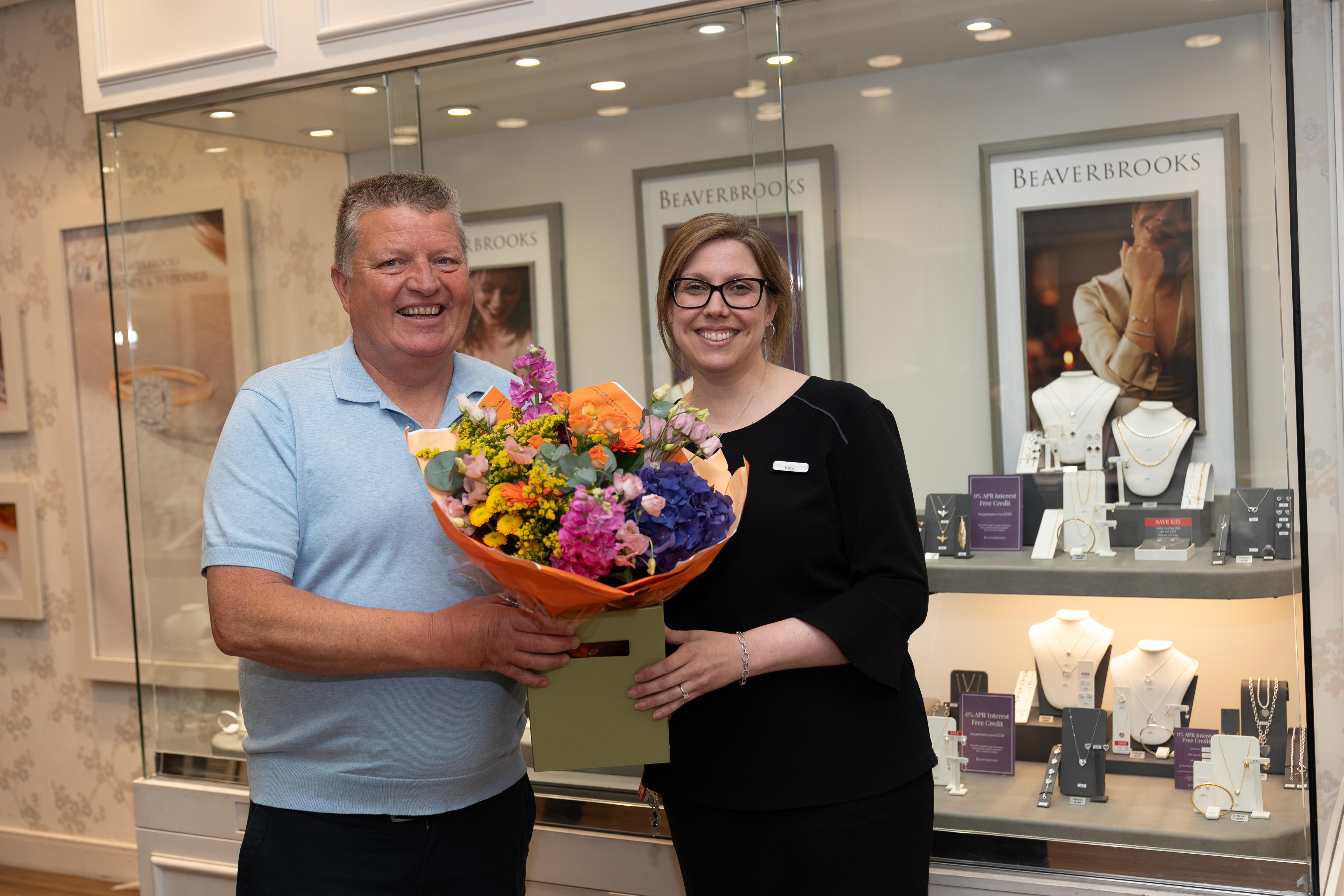 Lottery winner Gary MacDonald with Katie Feeney of Beaverbrooks in Lakeside Shopping Centre
