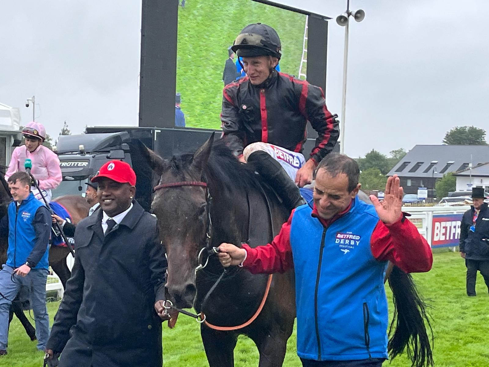 Tom Marquand with Maltese Cross following the Derby