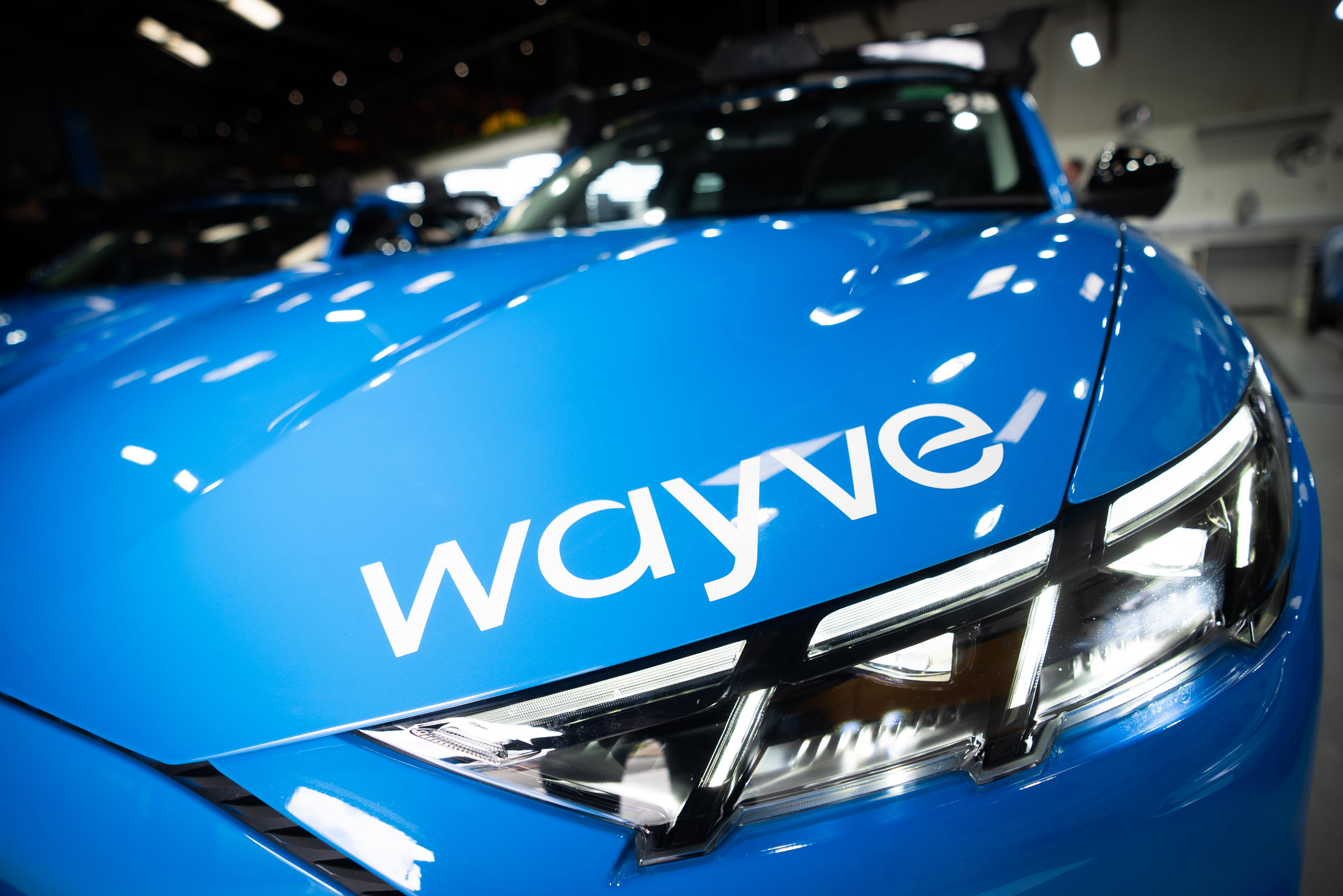 A Wayve logo on a car