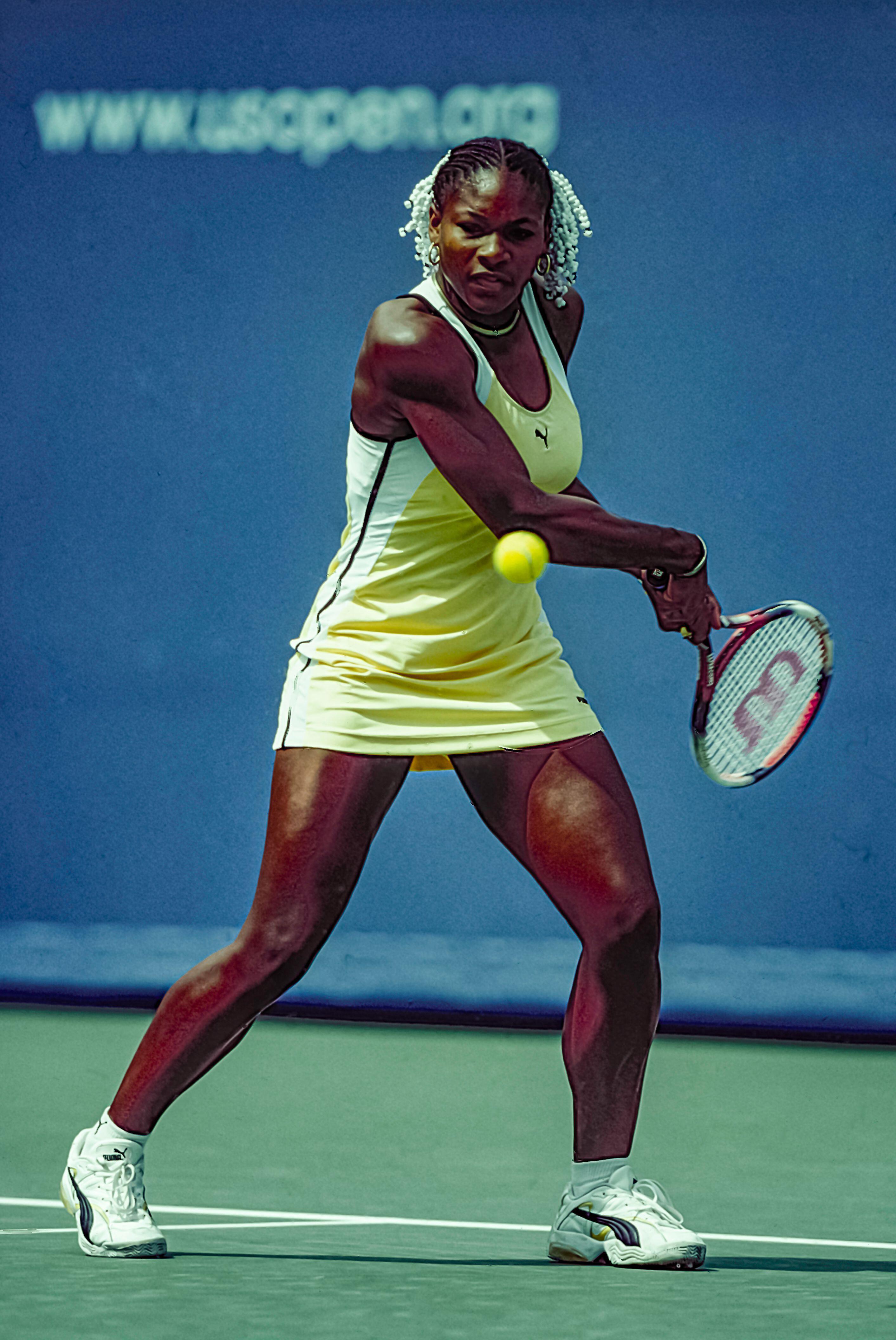 Serena Williams wearing a yellow Puma tennis dress when she won her first Grand Slam Tennis at the 1999 US Open.