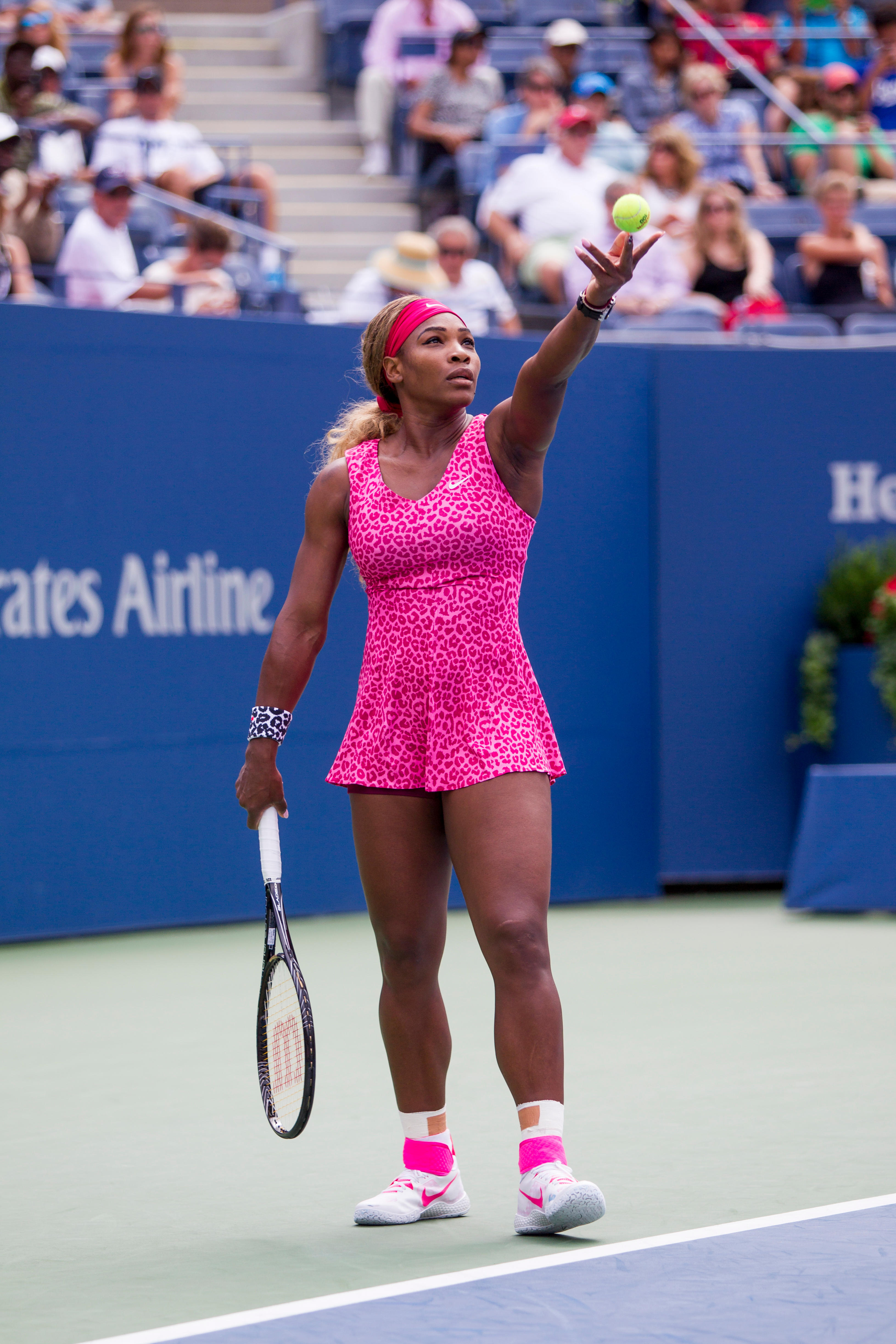 Serena Williams wearing a pink leopard print dress at the US Open in 2014