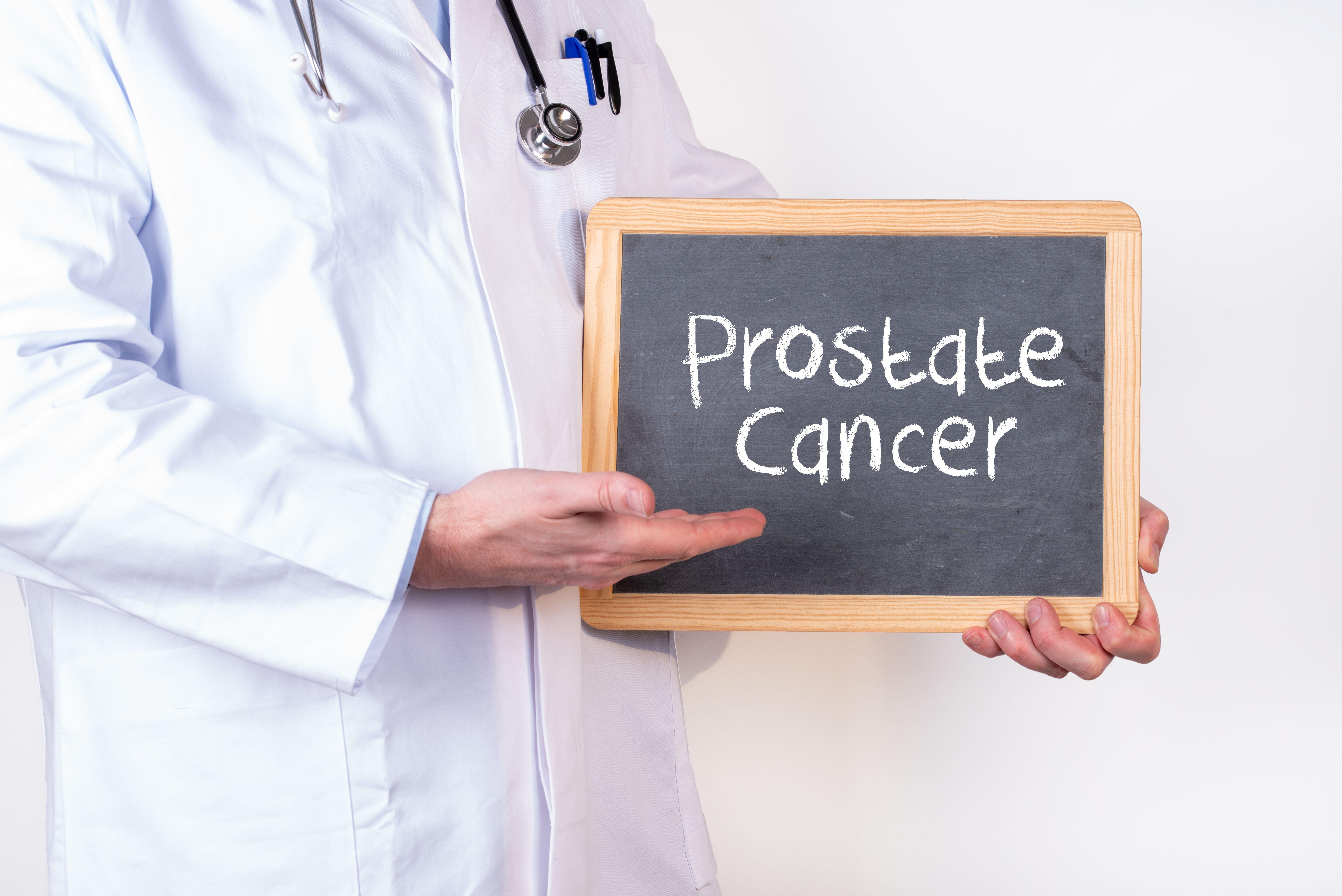 Doctor holding blackboard with ''Prostate Cancer'' written on it