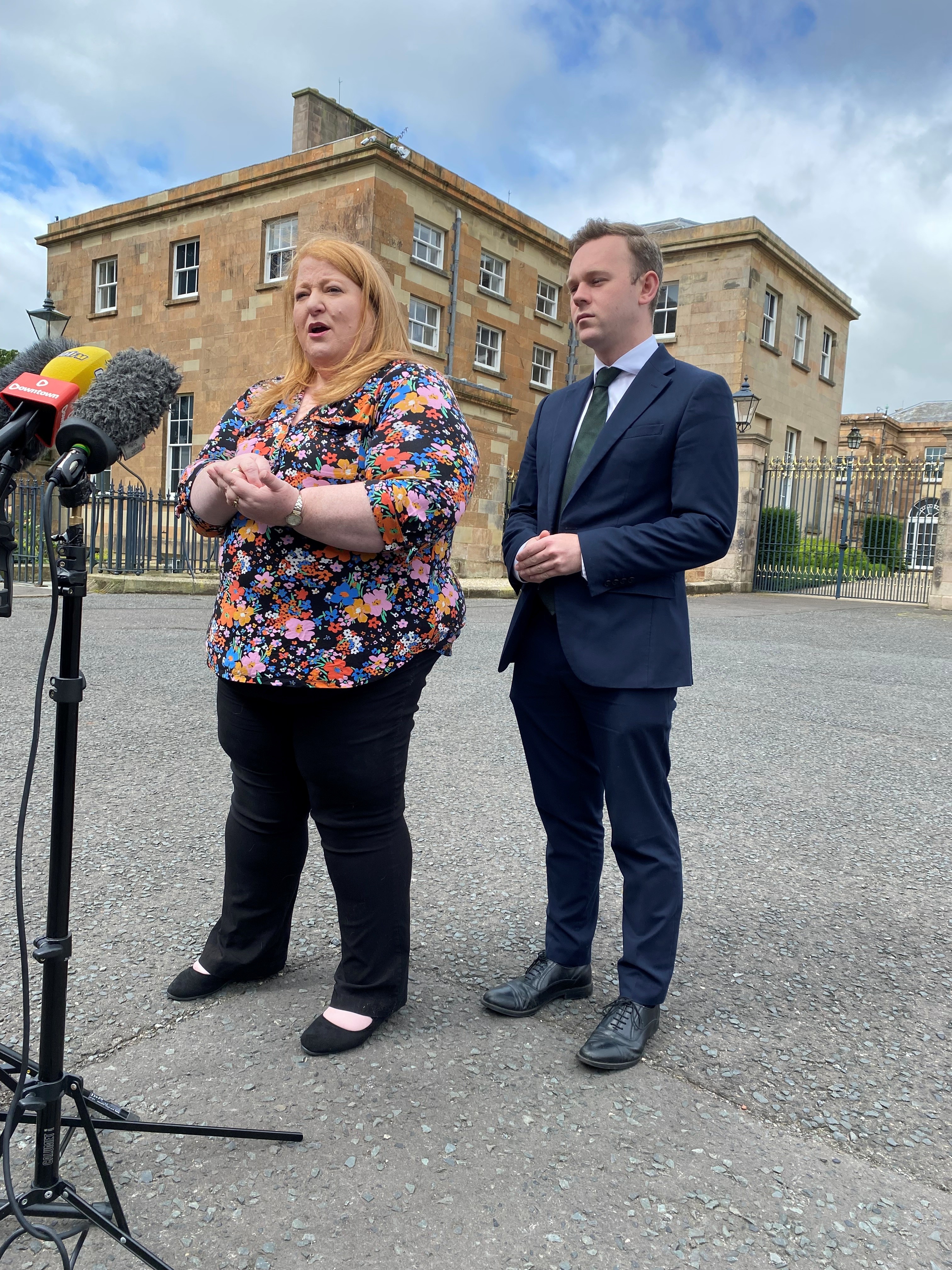 Naomi Long and deputy leader Eóin Tennyson speaking to the media