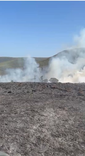 Smoke from a fire is seen in the Scottish Highlands
