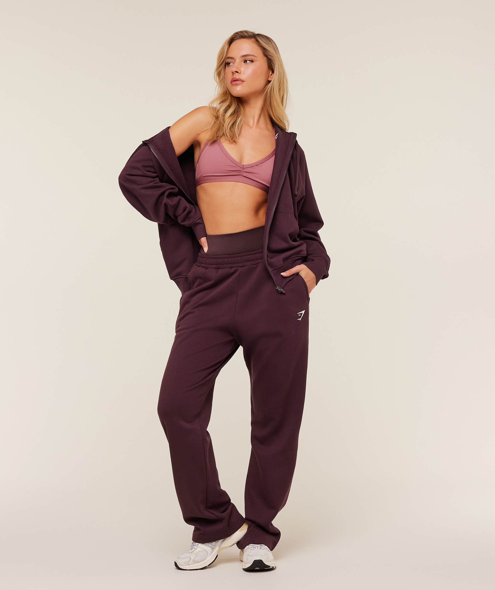 Gymshark Training Oversized Boxy Zip Through Hoodie in Cherry Purple, £38; Training Fleece Straight Leg Regular Joggers in Cherry Purple, £38