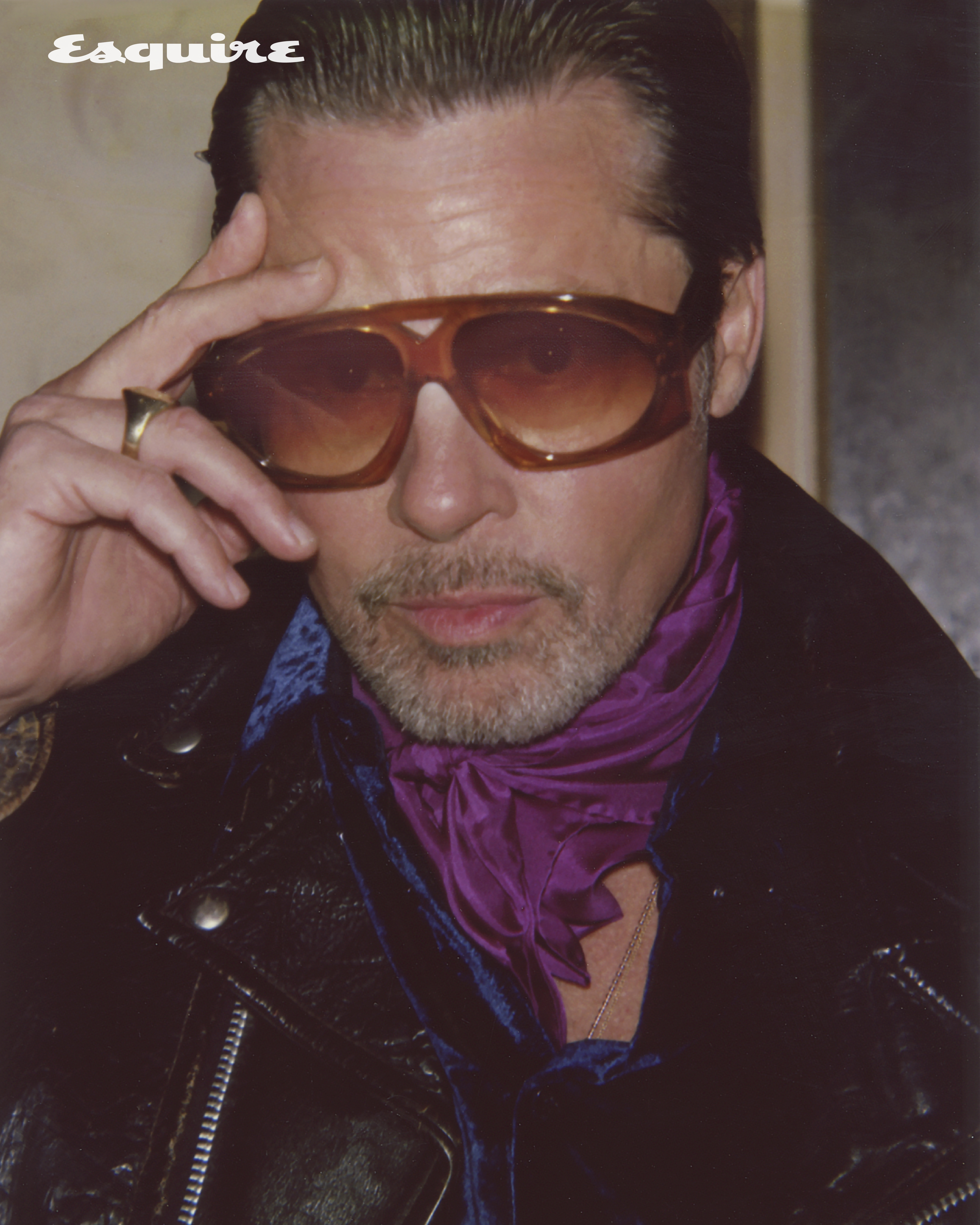 Brad Pitt wearing a pair of dark glasses