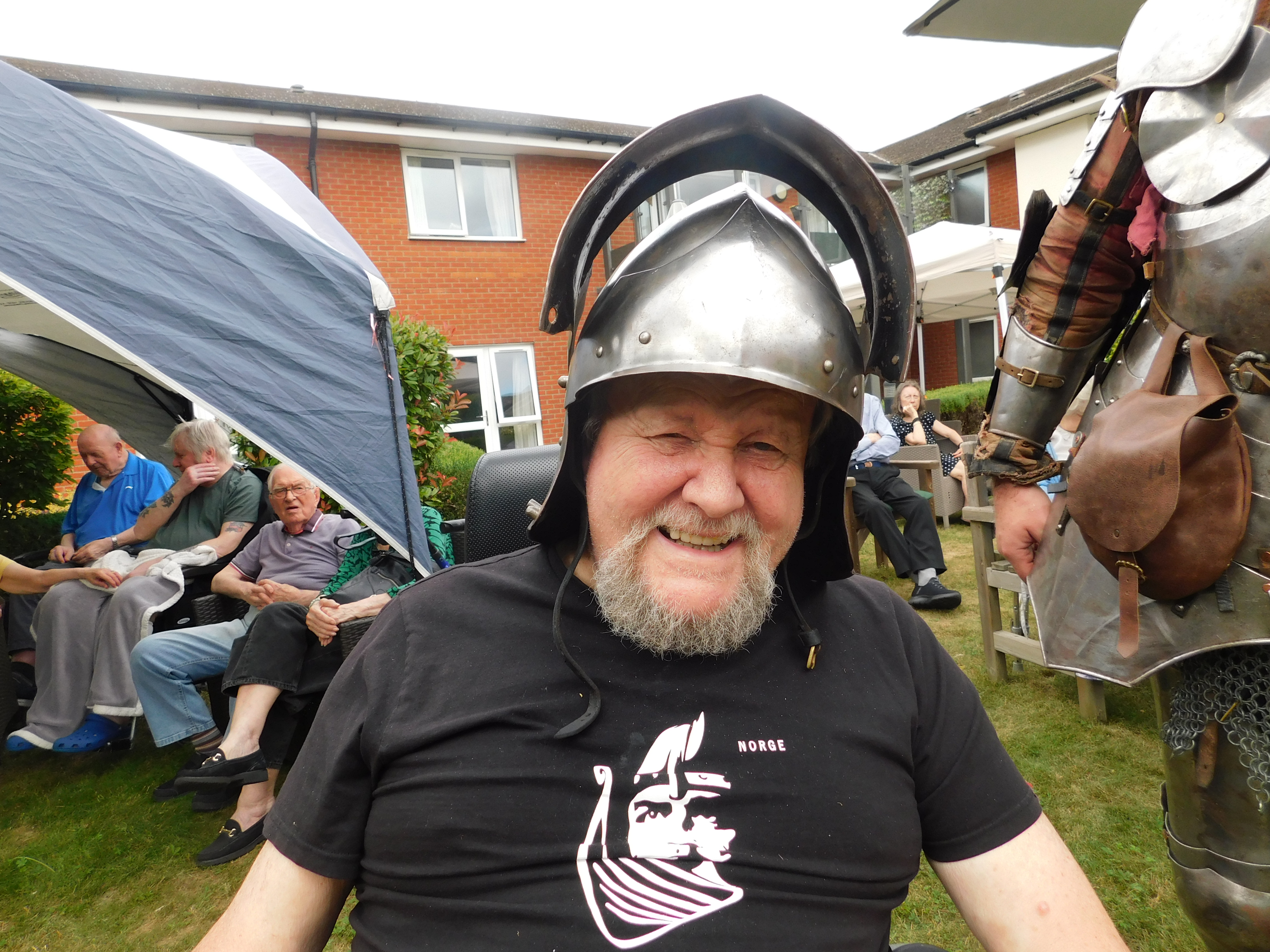 Care UK’s Hartismere Place care home in Eye, Suffolk, surprised resident Cliff Nicholson, 79, with a visit from members of a historical re-enactment group in suits of armour. (Care UK/ PA)