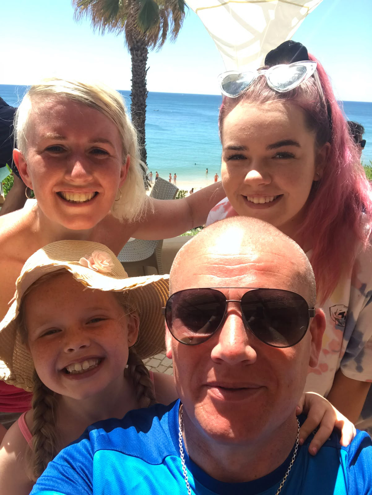 Damien Coakley, pictured with Antoinette, back left, and daughters Mia, front, and Leah on a family holiday