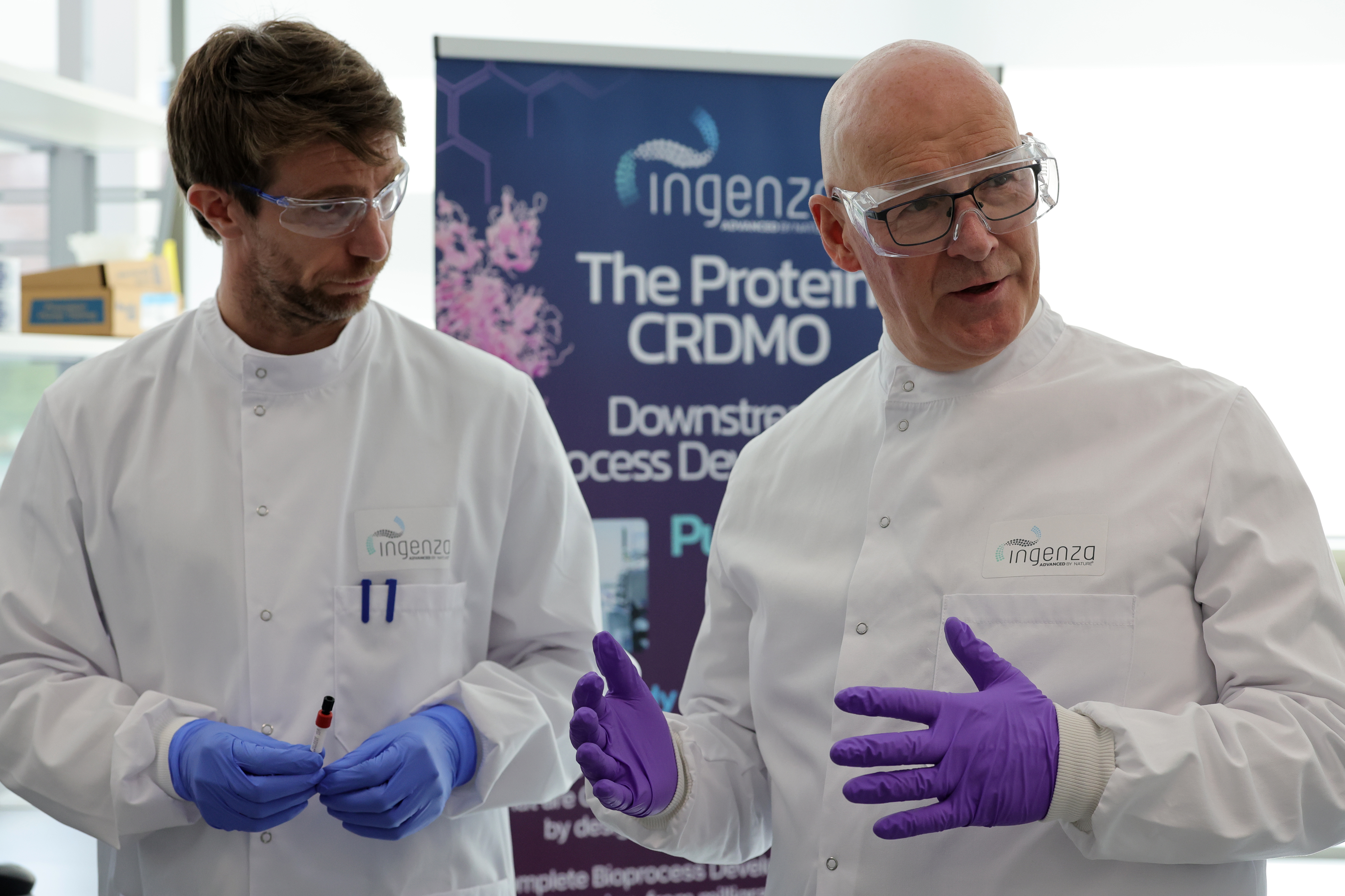 John Swinney in a white coat