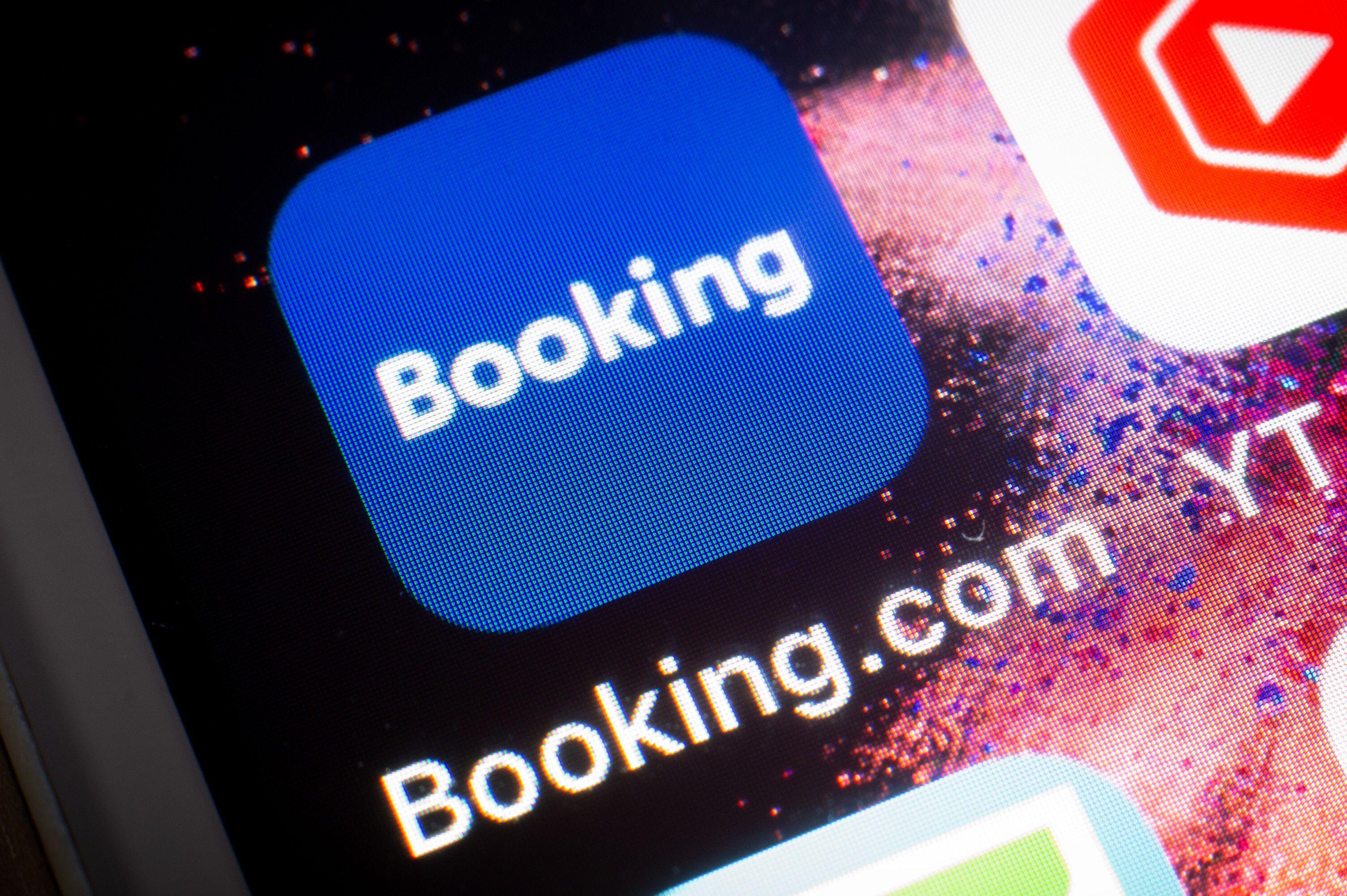 Booking.com app icon displayed on a smartphone