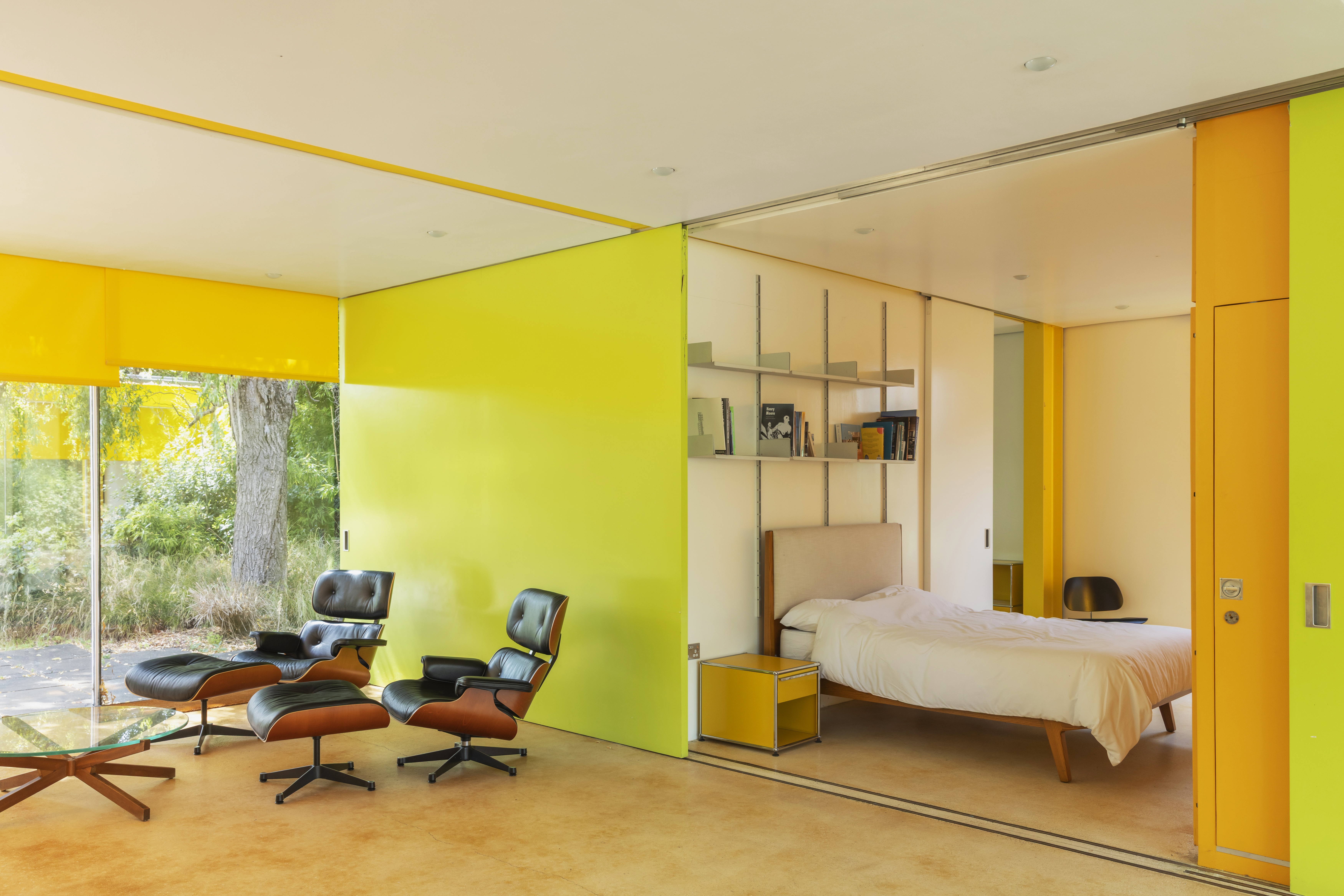Interior of a property which has bright green, yellow and orange walls and fittings