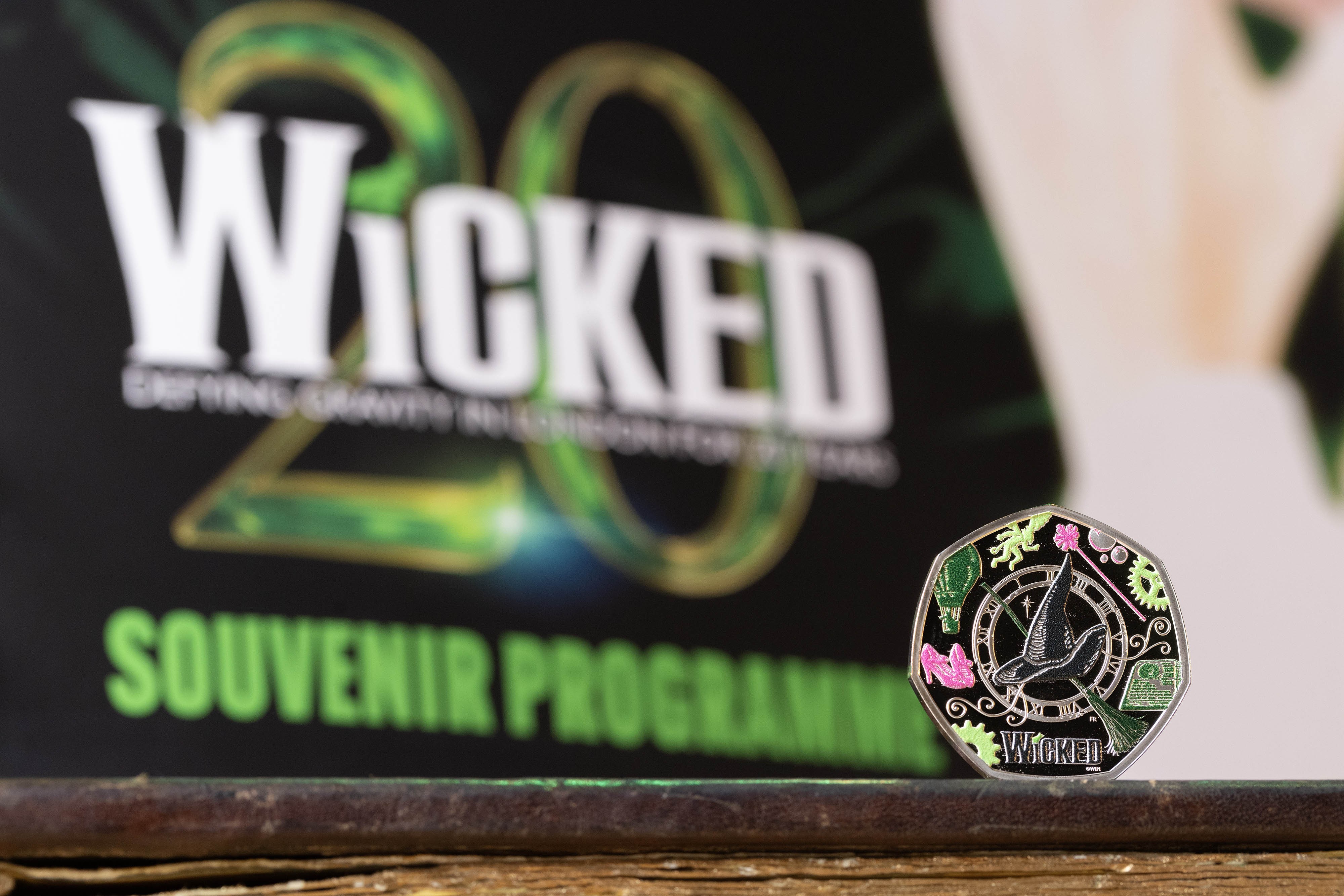 Wicked coin with a souvenir programme