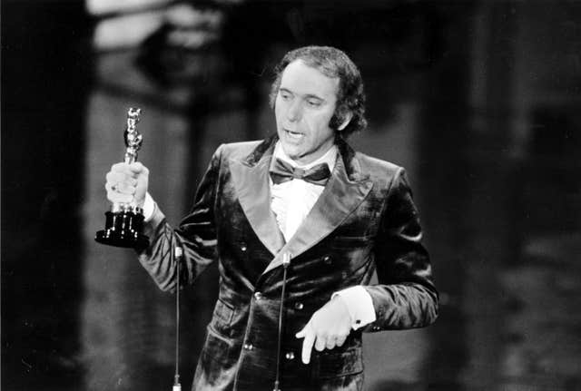 Producer Albert S Ruddy accepts the Oscar for best picture for The Godfather at the 45th Annual Academy Awards ceremony in Los Angeles, California, on March 27 1973