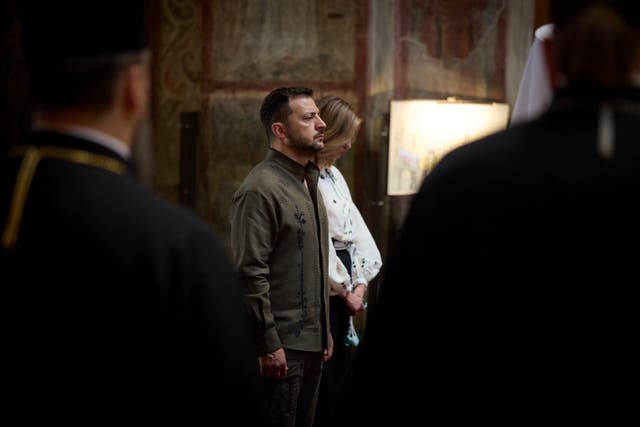 Ukrainian President Volodymyr Zelensky and his wife Olena attend a service in Saint Sophia Cathedral during celebration of the Ukrainian Independence Day in Kyiv