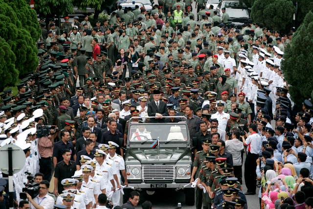 Abdullah waves at a huge crowd