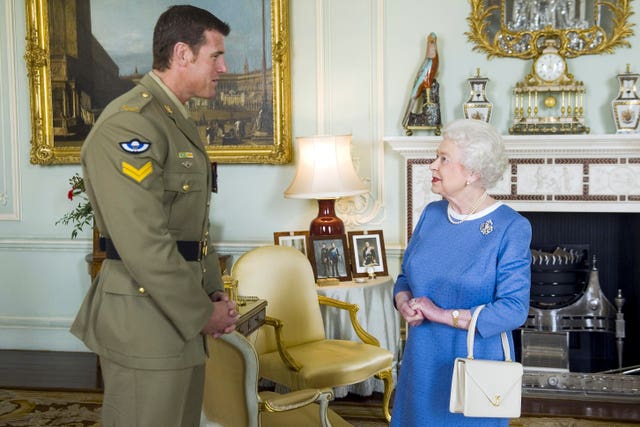 The Queen with Corporal Ben Roberts-Smith, from Australia, who was recently awarded the Victoria Cross, during an audience at Buckingham Palace on November 15 2011