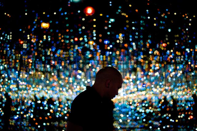 A man views Yayoi Kusama’s Infinity Mirrored Room at the Broad museum in Los Angeles