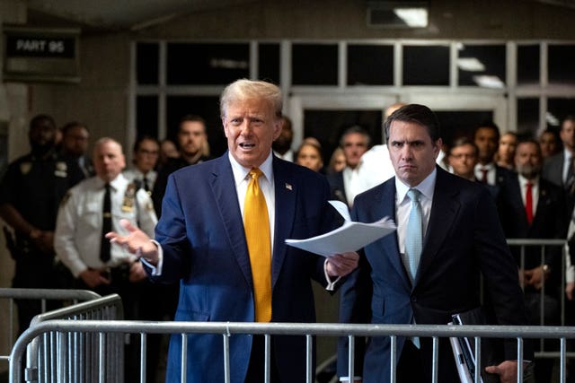 Donald Trump speaks before the start of proceedings in his trial at Manhattan Criminal Court in New York