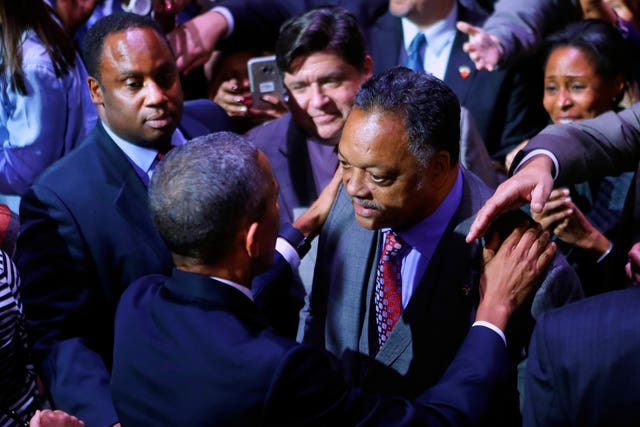 Then-president Barack Obama talks with Rev Jesse Jackson