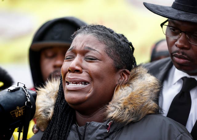 Kenyana Dixon tearfully addresses a crowd gathered during a rally for her brother Tyre Nichols at the National Civil Rights Museum