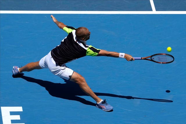 Dan Evans stretches for a forehand